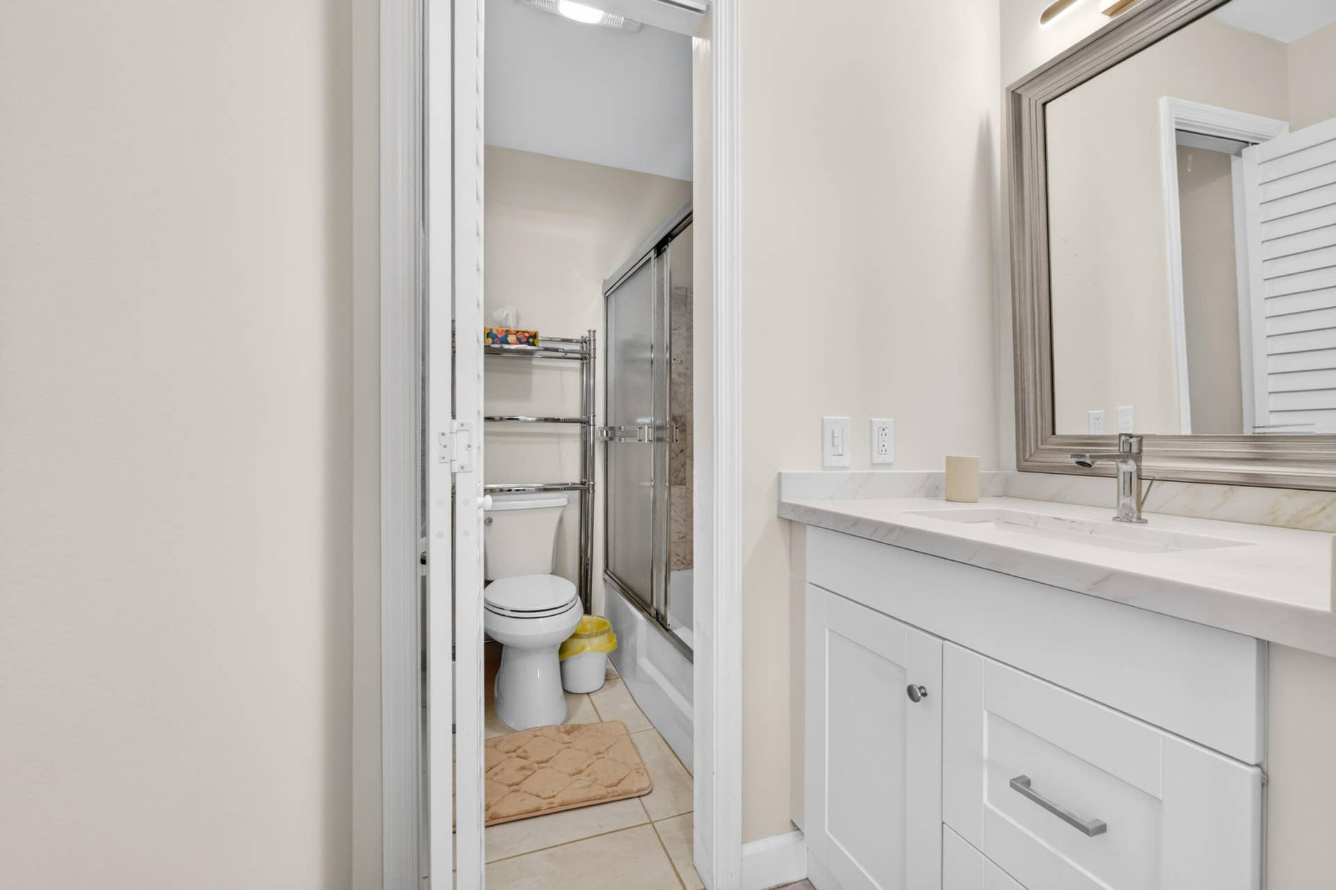 6359 Bay Club Drive, #2, Fort Lauderdale, FL 33308 Modern bathroom featuring a white vanity with dual-drawer storage, white quartz countertop, and chrome faucet hardware