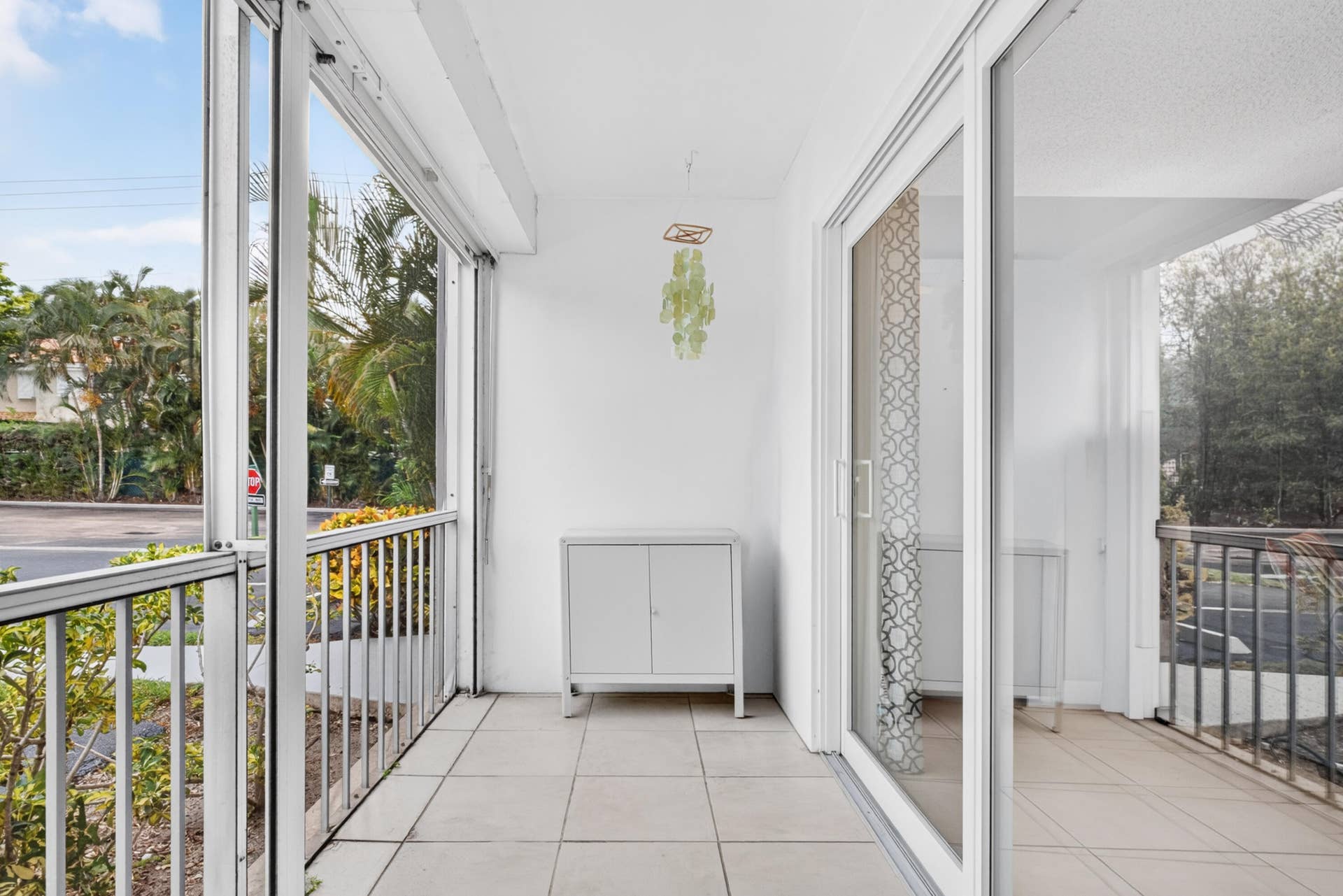 6359 Bay Club Drive, #2, Fort Lauderdale, FL 33308 Enclosed patio featuring floor-to-ceiling glass panels and tile flooring