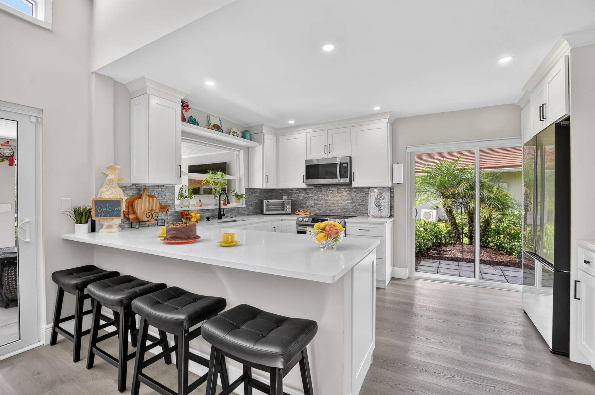 2738 DEER CREEK KELLY BROOKE Lane, Deerfield Beach, FL 33442 Upgraded kitchen shines with quartz counters, 36" Shaker cabinets and 4 year NEW Samsung stainless steel appliances.