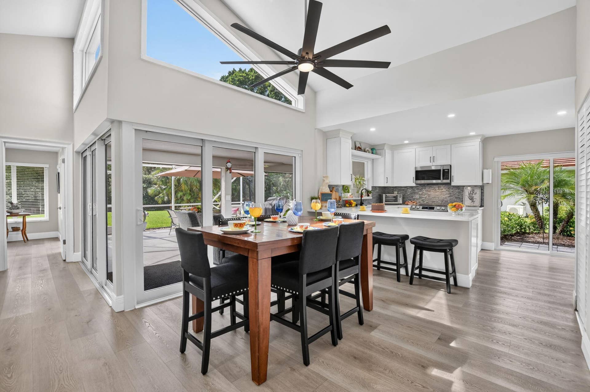 2738 DEER CREEK KELLY BROOKE Lane, Deerfield Beach, FL 33442 Bright dining area opens directly to the covered, screened patio.