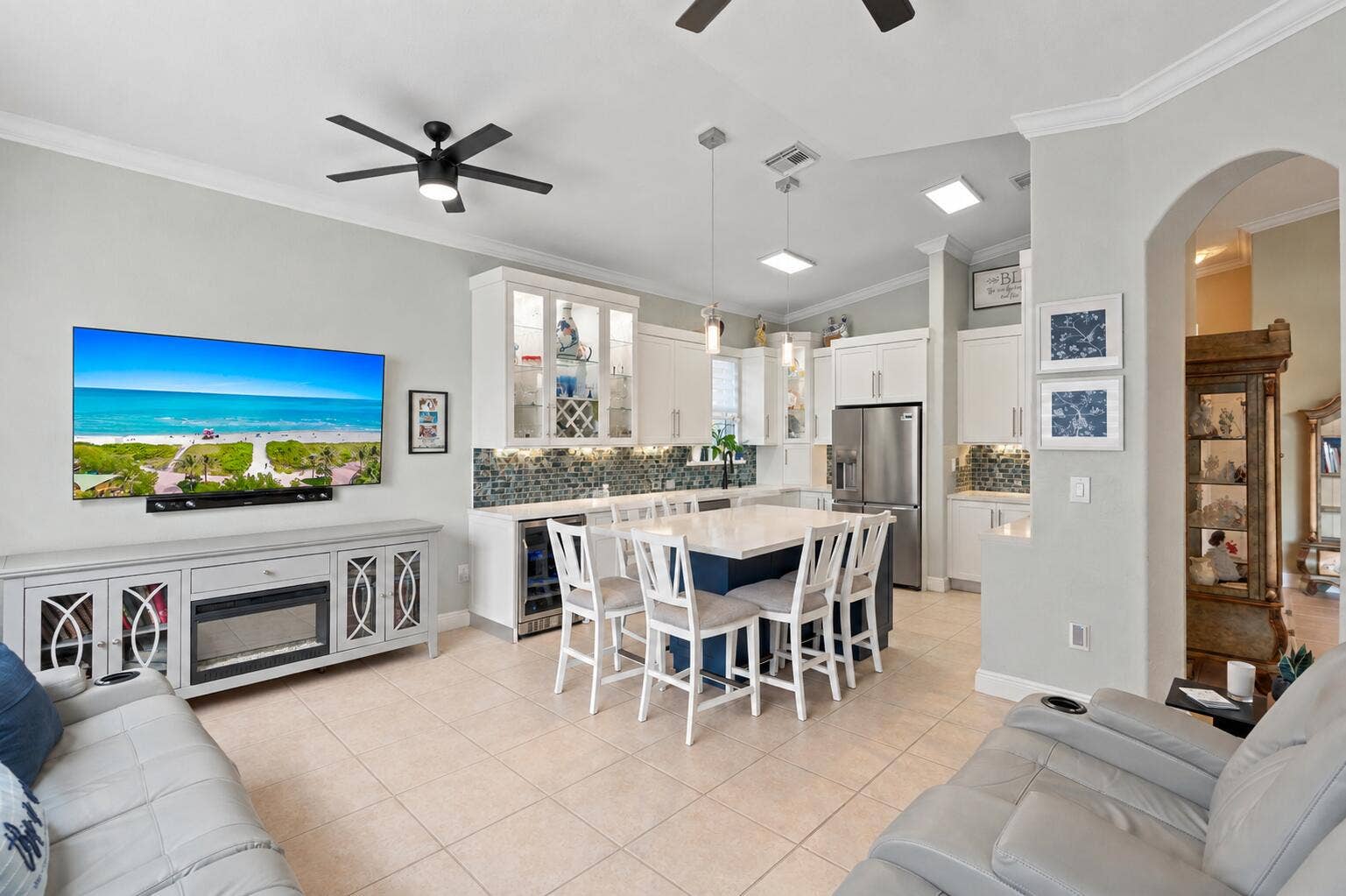 The kitchen and family room come together in a bright, connected gathering space.