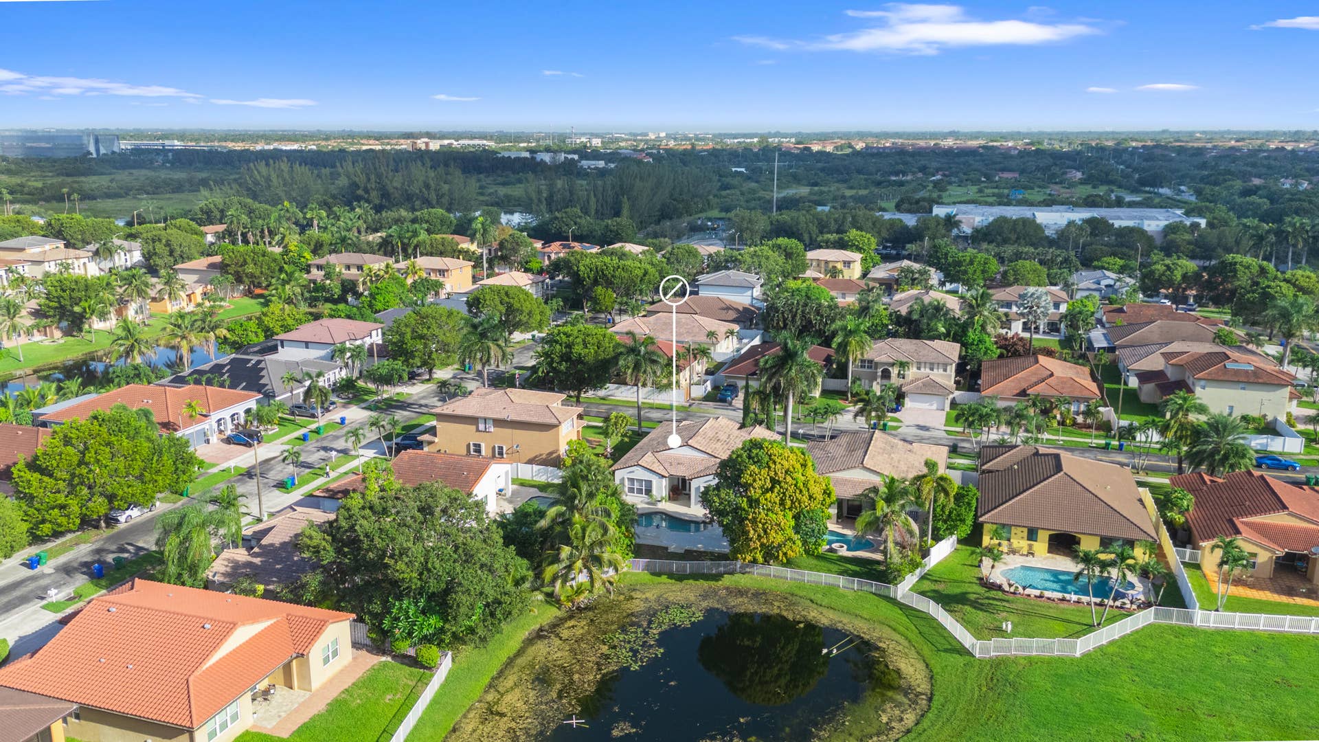 Wide aerial perspective showcases the homes location within the surrounding neighborhood.
