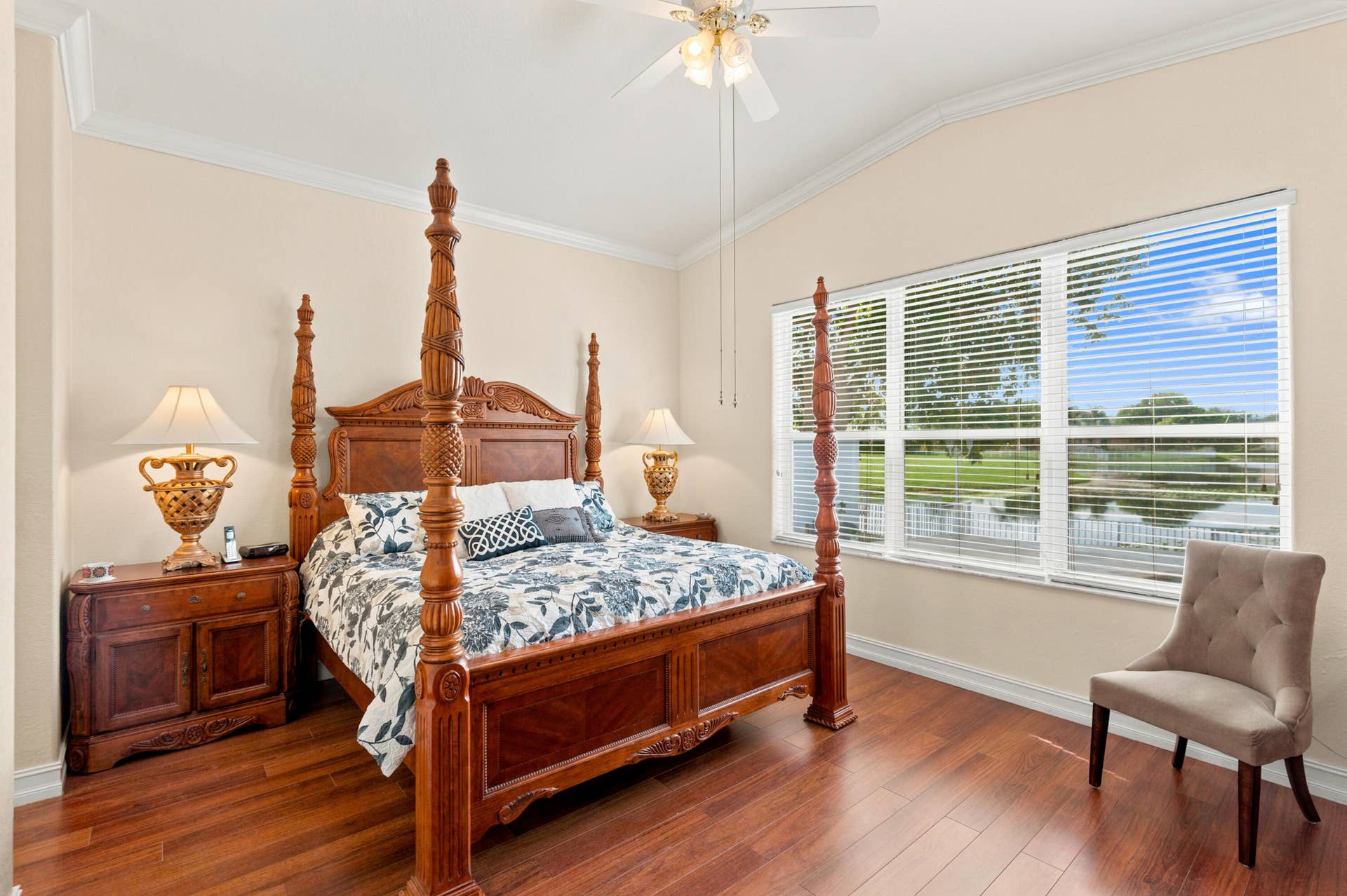 Natural light and peaceful water views create an inviting backdrop for the primary suite.