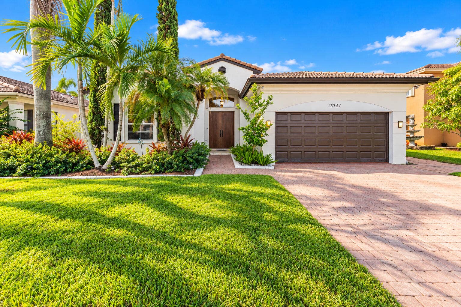 Waterfront, single-story living with 3-BD, 2.5-BA home offers 1,881 sq. ft. of living area with private heated pool, renovated 2023 kitchen, and flexible den/office room.