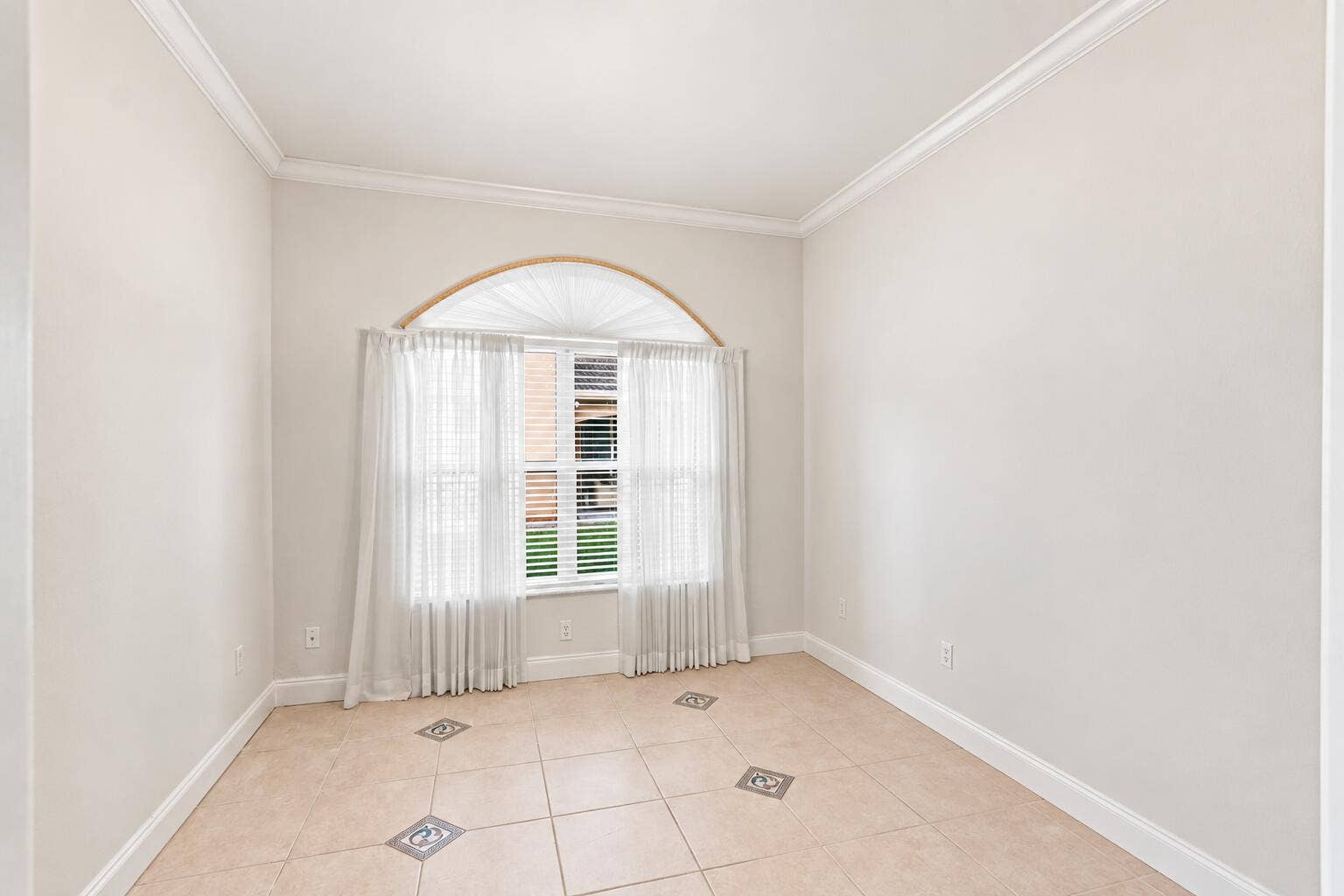 Flexible room that can be used as a den, home office, or home gym.