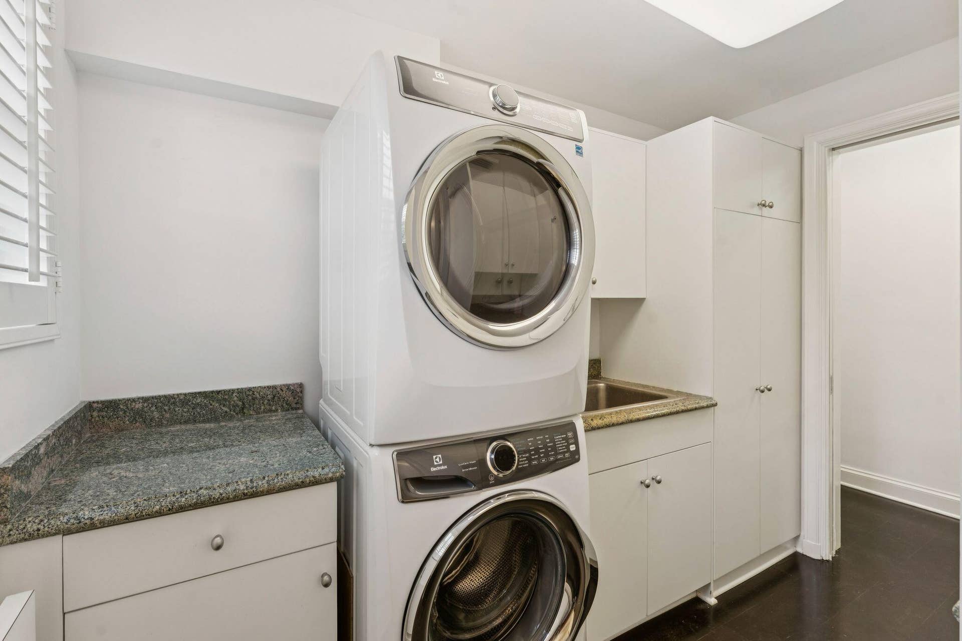 425 WORTH Avenue, #2F, Palm Beach, FL 33480 laundry room with staff bath