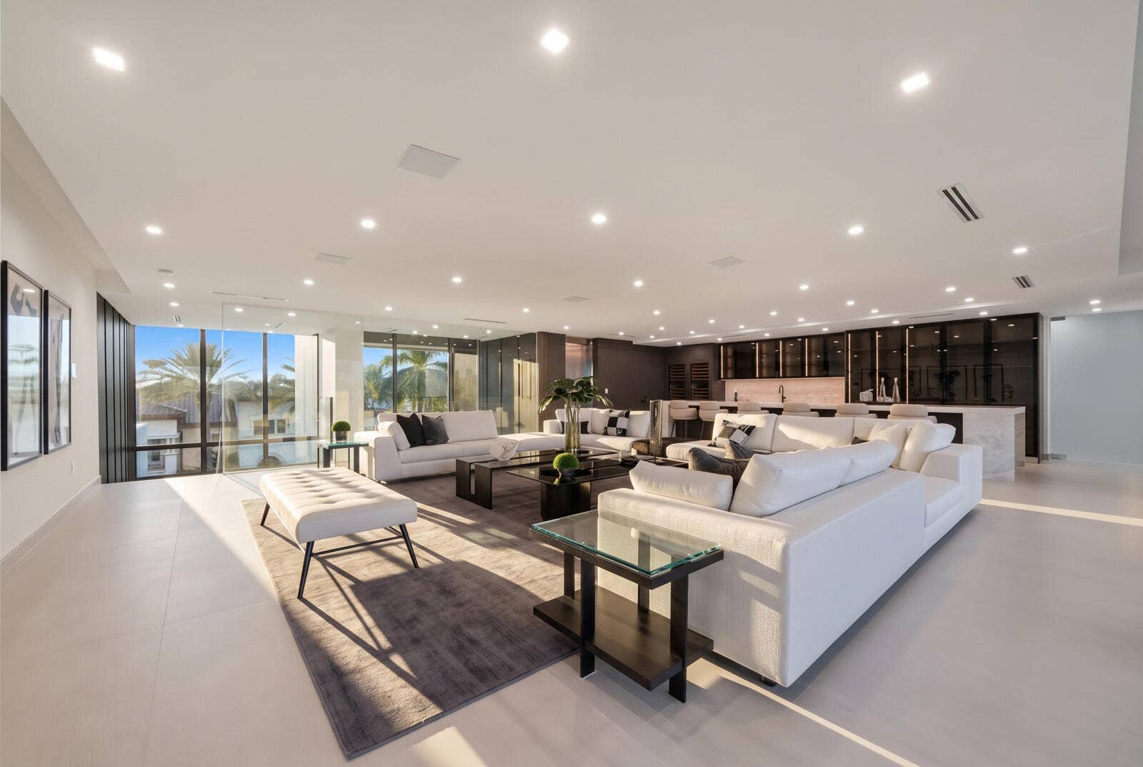 414 ROYAL PLAZA Drive, Fort Lauderdale, FL 33301 Entire third level conceived as a private entertainment destination, combining an expansive sky lounge, illuminated onyx bar, dual wine storage, and abundant natural light.