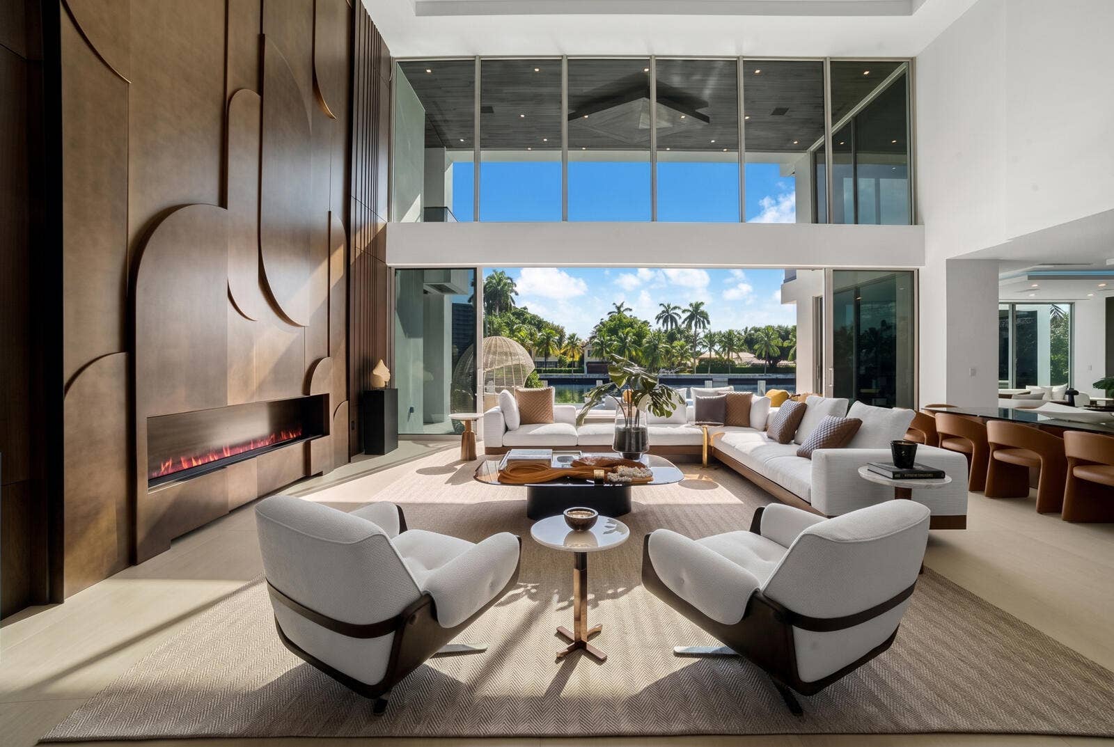 414 ROYAL PLAZA Drive, Fort Lauderdale, FL 33301 Sun-filled waterfront great room featuring floor-to-ceiling glass, refined designer furnishings, and seamless views of the pool and canal.