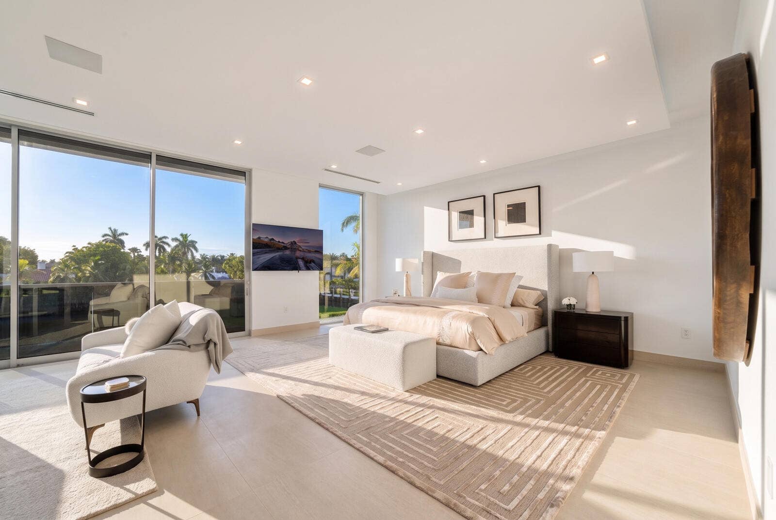 414 ROYAL PLAZA Drive, Fort Lauderdale, FL 33301 Serene second-floor primary bedroom featuring a private waterfront sitting area, walls of glass, and direct access to the covered terrace.
