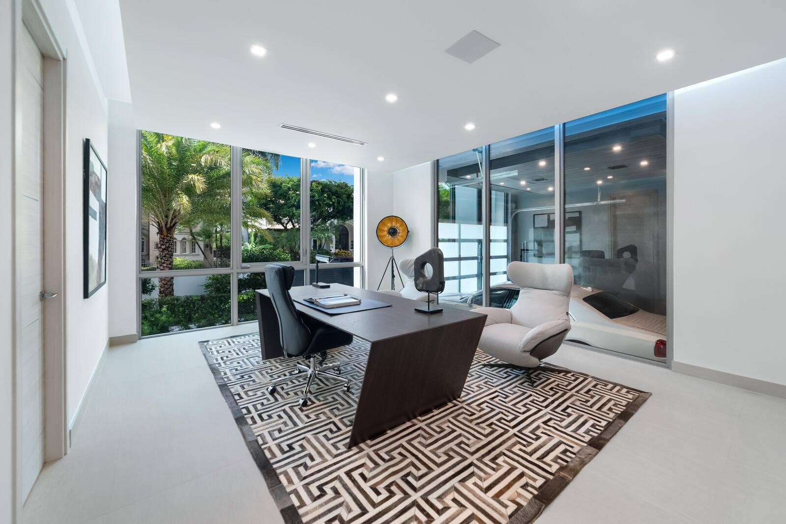 414 ROYAL PLAZA Drive, Fort Lauderdale, FL 33301 Exceptional executive office featuring a glass wall overlooking the climate-controlled automobile gallery, located within the three-car garage on the left side of the residence.