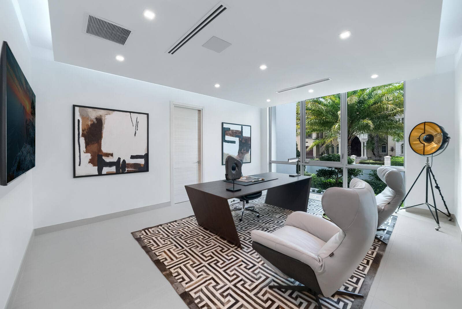 414 ROYAL PLAZA Drive, Fort Lauderdale, FL 33301 Sophisticated first-floor executive office featuring floor-to-ceiling windows, contemporary designer finishes, abundant natural light, and serene views of the tropical landscaping.