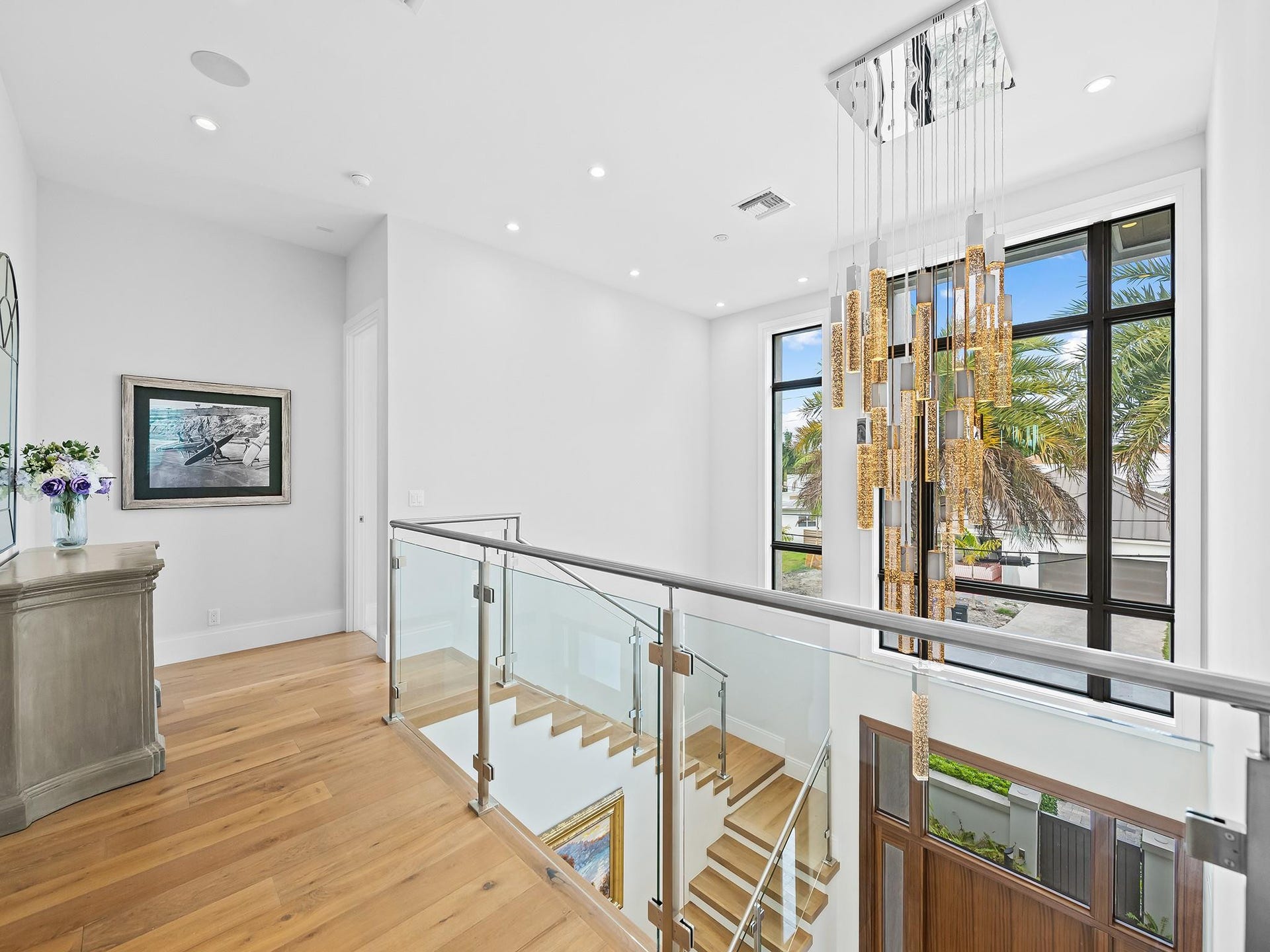 301 NE 23RD Avenue, Fort Lauderdale, FL 33305 View from the upstairs landing offers a serene glimpse of the home's open, airy design, creating a perfect transition