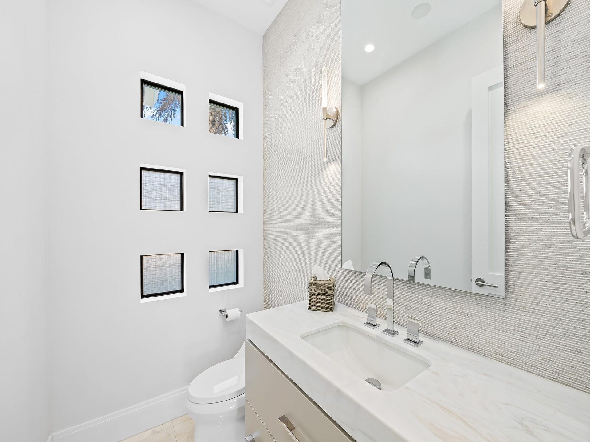 A well-placed powder room on the main floor offers convenient access for everyone.