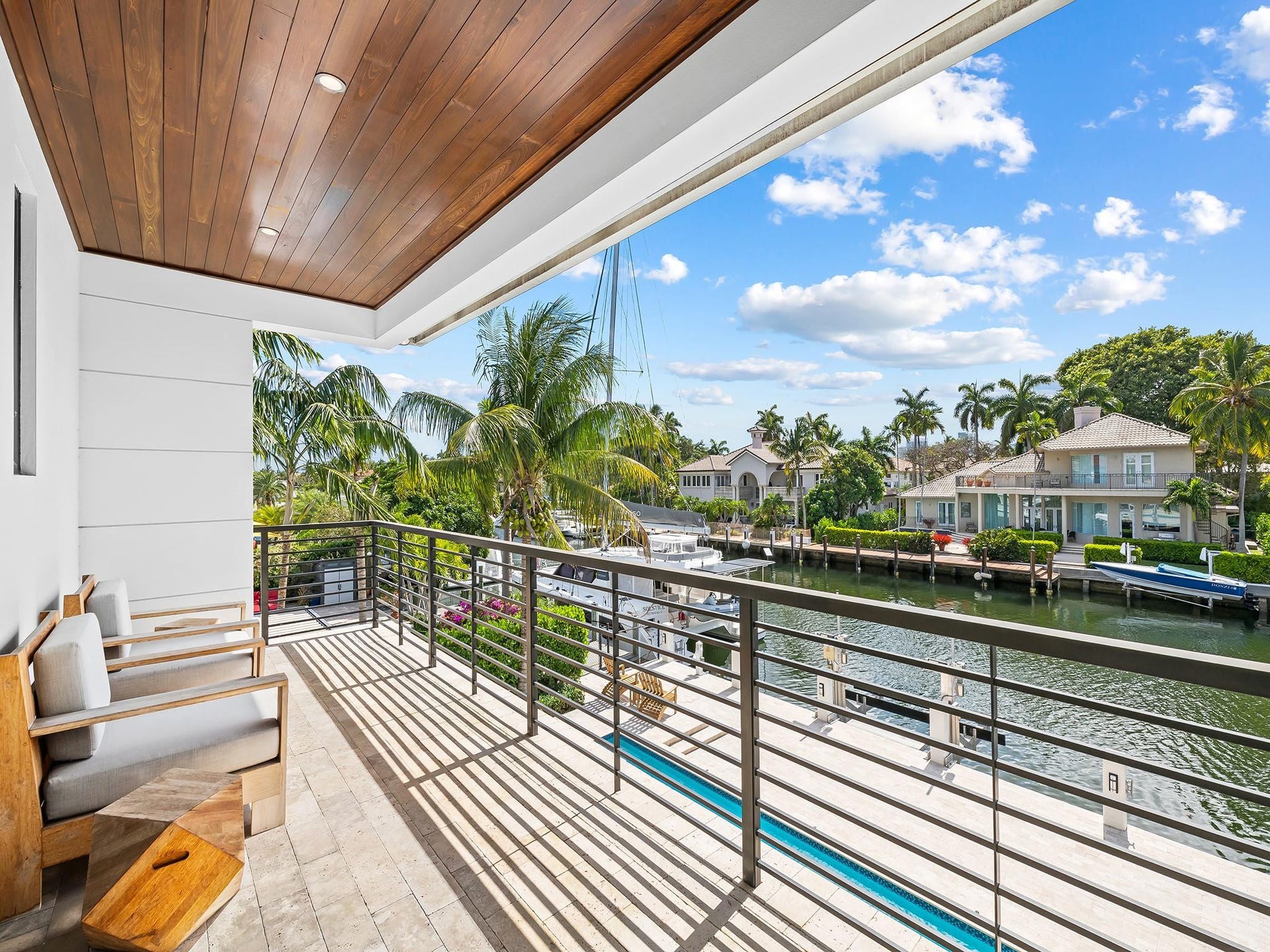 Private balcony overlooking the primary poolside, perfect for relaxation and stunning sunsets