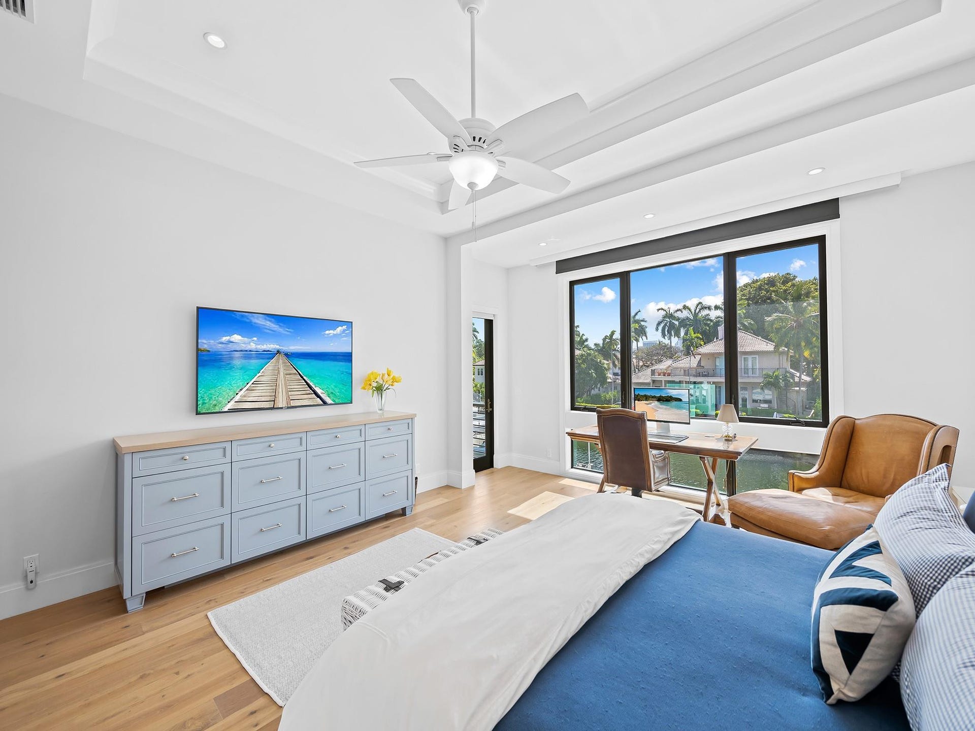 301 NE 23RD Avenue, Fort Lauderdale, FL 33305 Ample natural lighting throughout the primary suite. Electric shades and blackouts