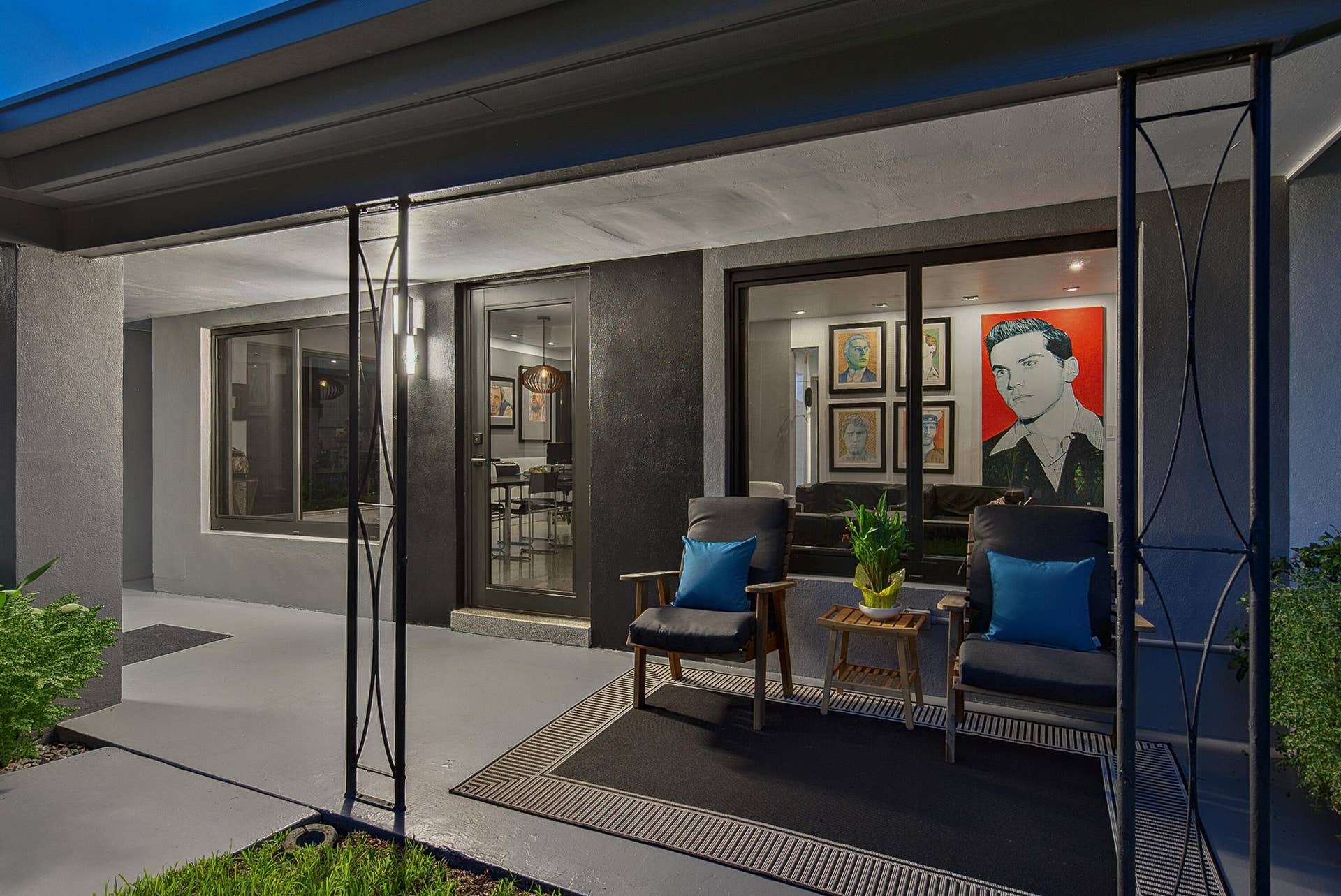 4850 NE 5TH Avenue, Oakland Park, FL 33334 Covered patio with a glass-paneled entry door and wall of windows brings the outside in day and night