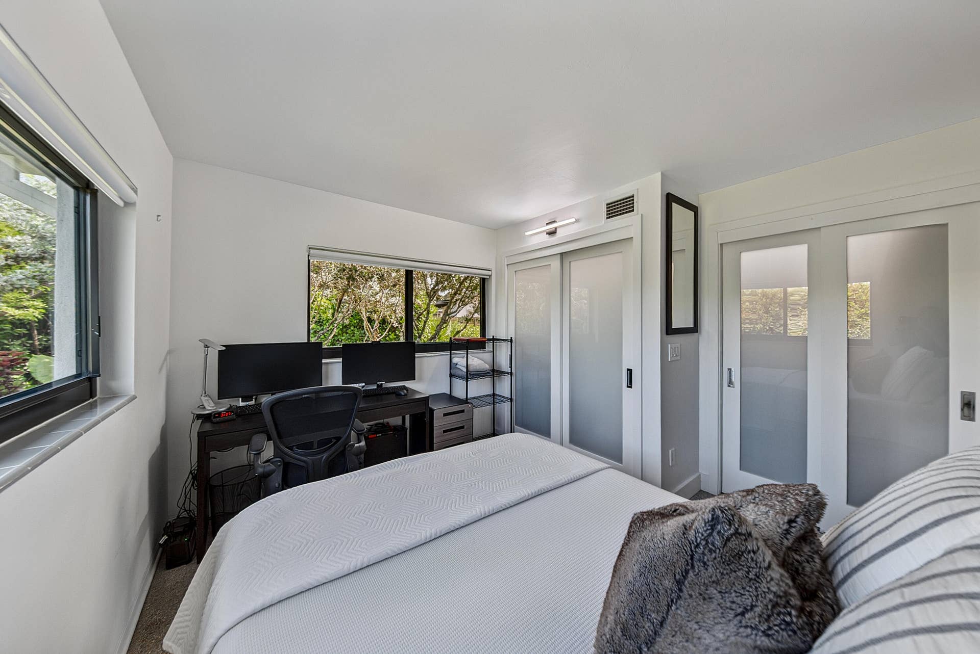 4850 NE 5TH Avenue, Oakland Park, FL 33334 Recessed lighting, large windows, sliding closet doors with frosted glass panels, and built-in overhead lighting
