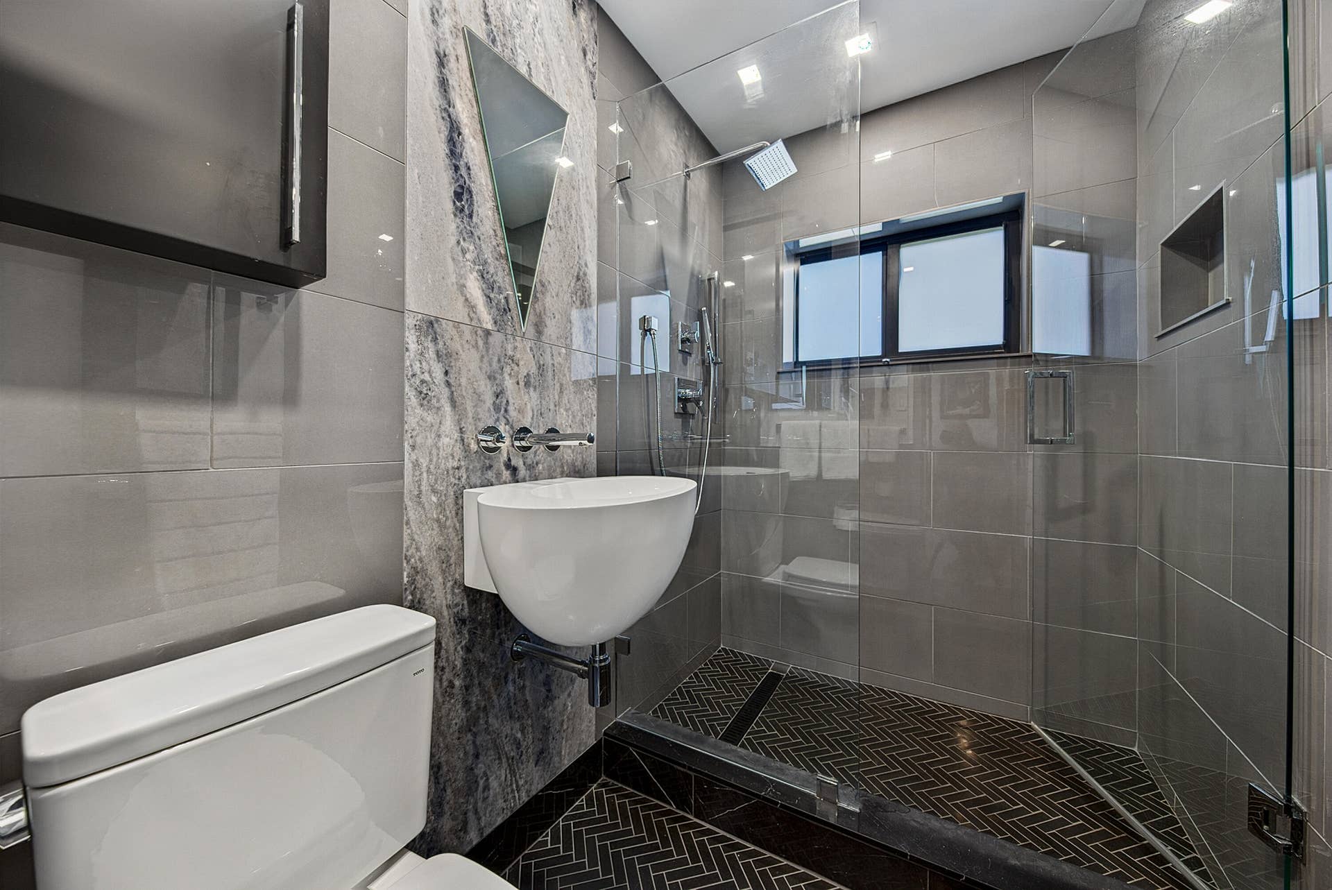 4850 NE 5TH Avenue, Oakland Park, FL 33334 Main bath features a Walk-in shower with a glass enclosure and designer vanity