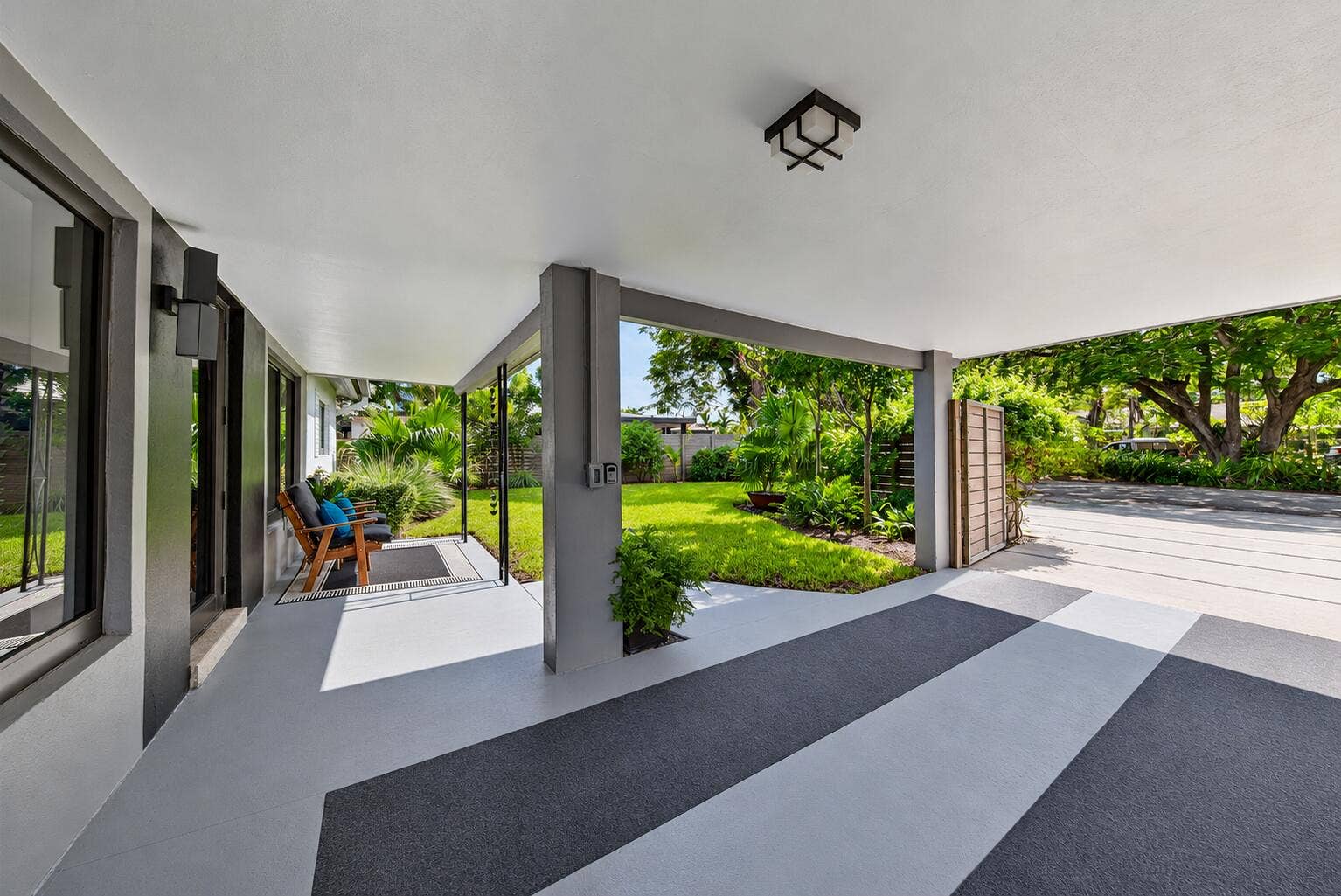 4850 NE 5TH Avenue, Oakland Park, FL 33334 Covered carport provides protection for your car and for you from the rain