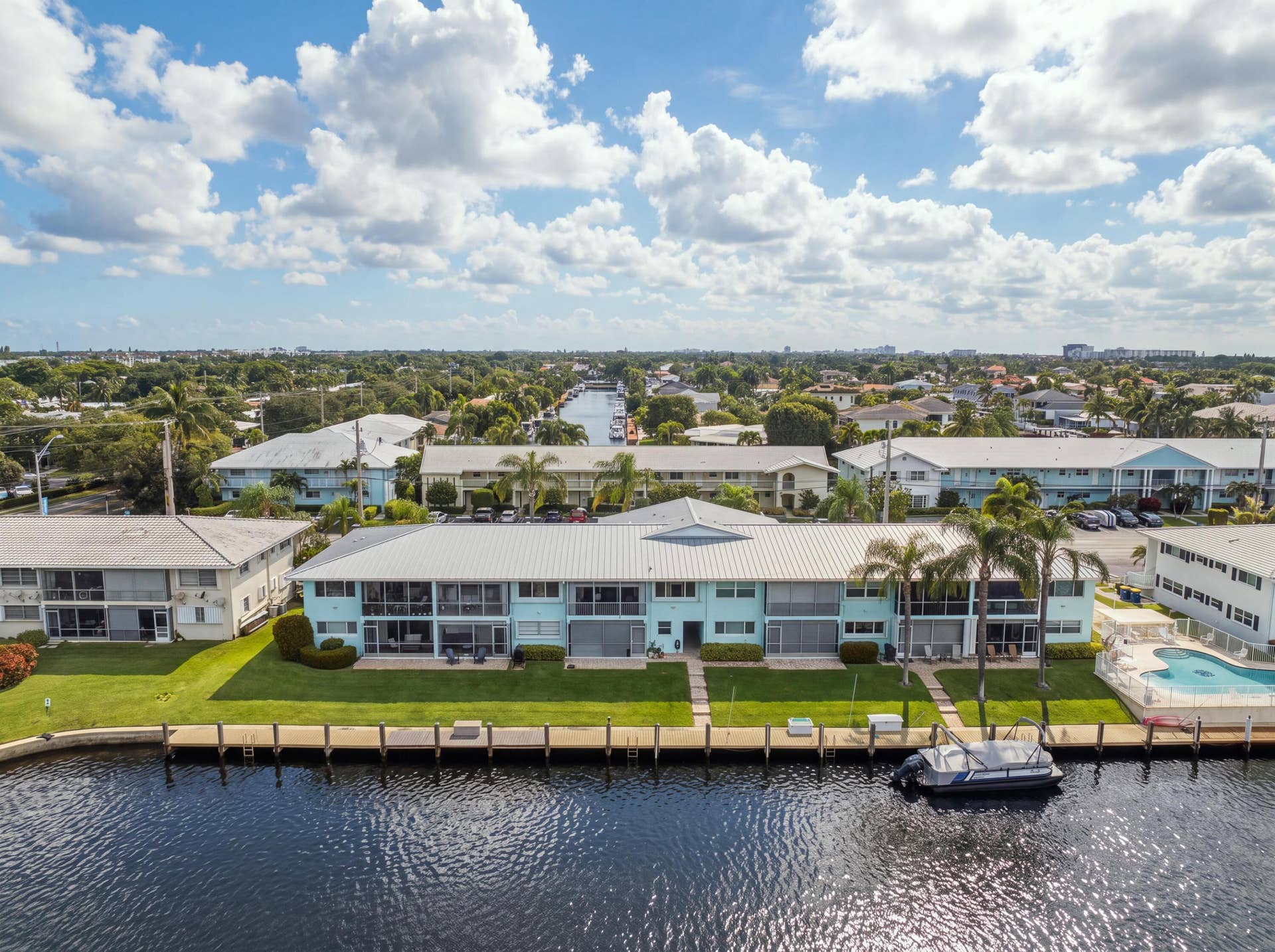 2330 NE 36th Street, #11, Lighthouse Point, FL 33064 Waterfront property with canal frontage, private dock, and a communal swimming pool