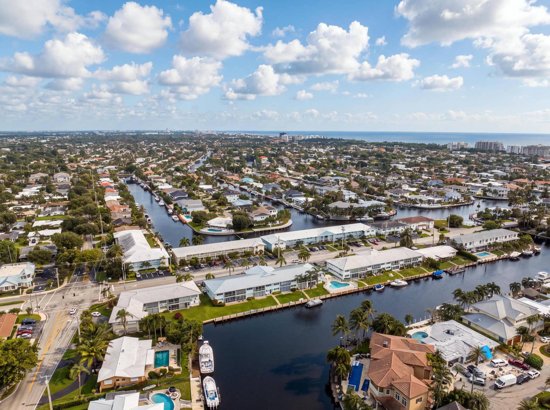 2330 NE 36th Street, #11, Lighthouse Point, FL 33064 Waterfront community featuring canal access, residential properties, and distant ocean scenery
