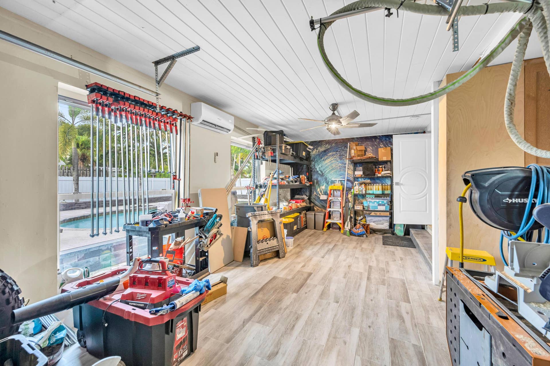 301 SE 3RD Terrace, Dania Beach, FL 33004 Garage with new garage door and air conditioner