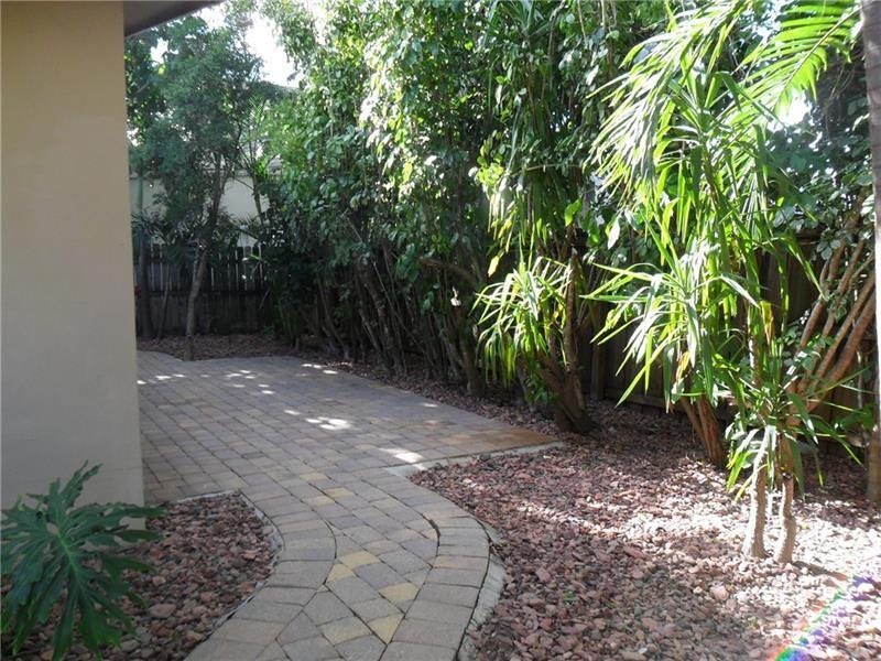 Wrap around patio covers entire back half of property.