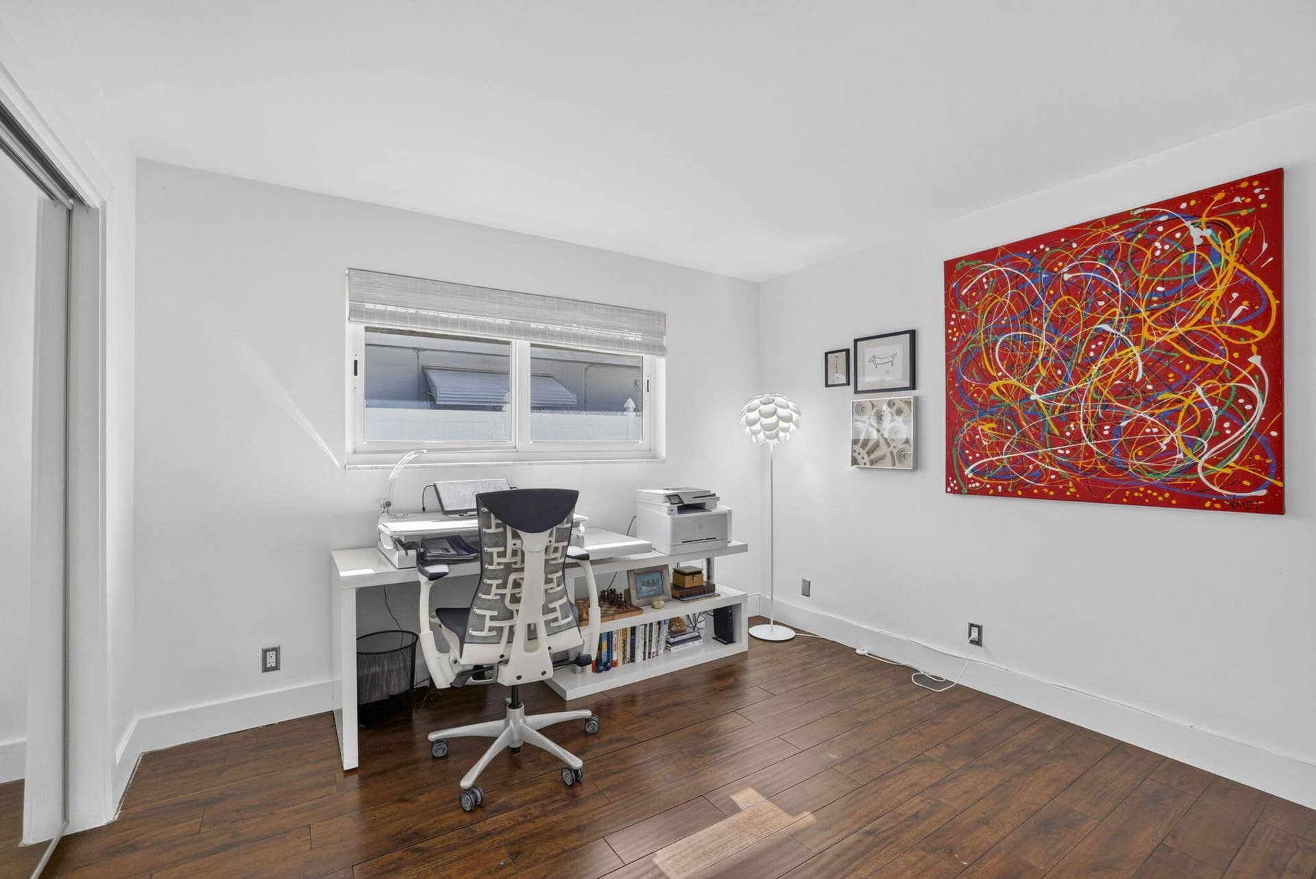 Bright interior with wood-finish flooring and a large window