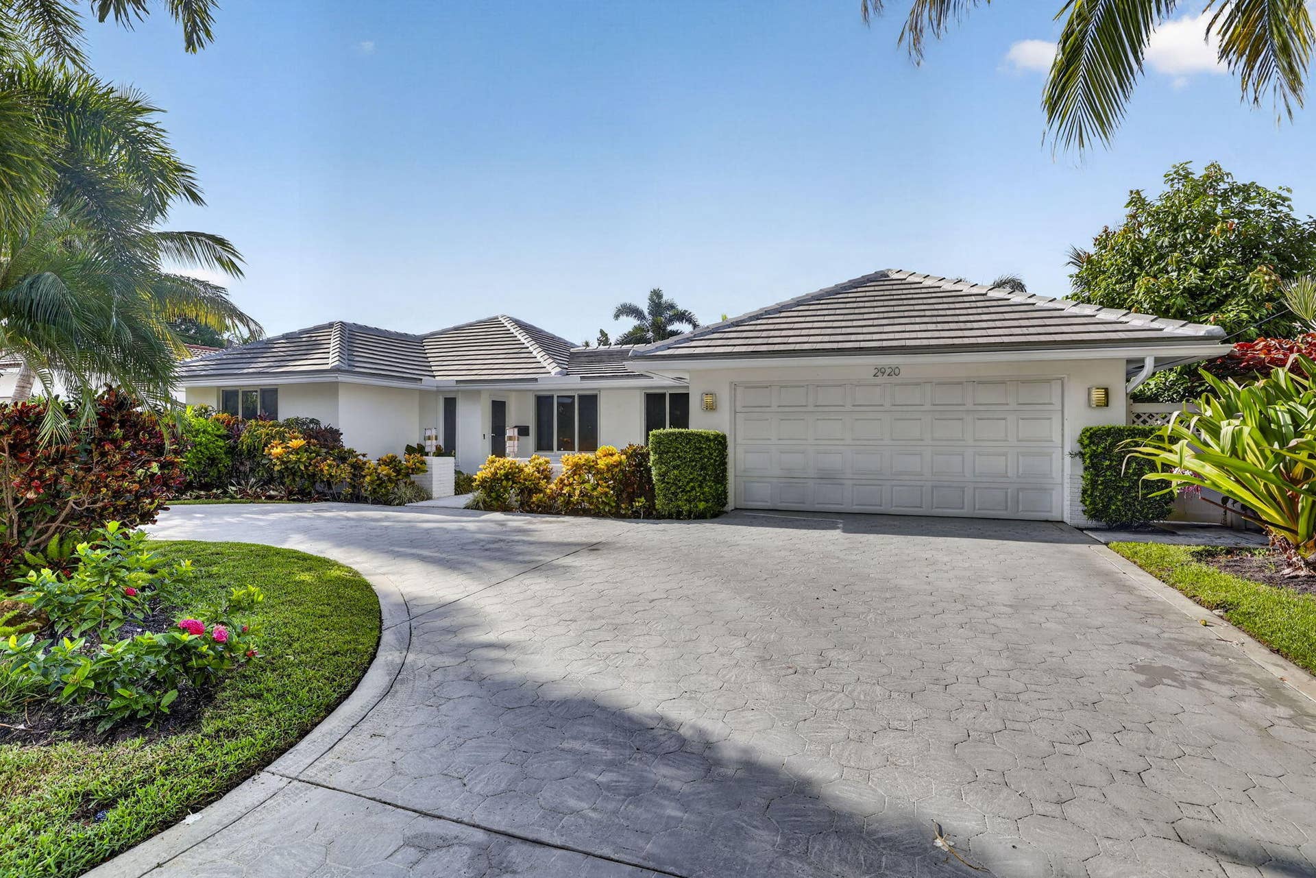 White stucco exterior with a tiled roof