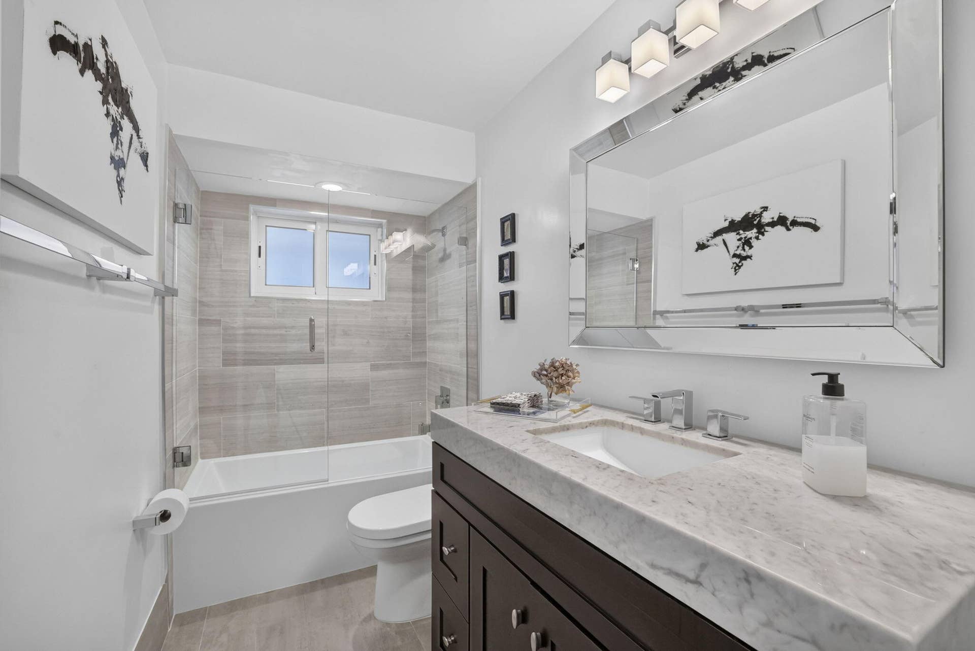 Floating vanity with stone countertop and integrated sink