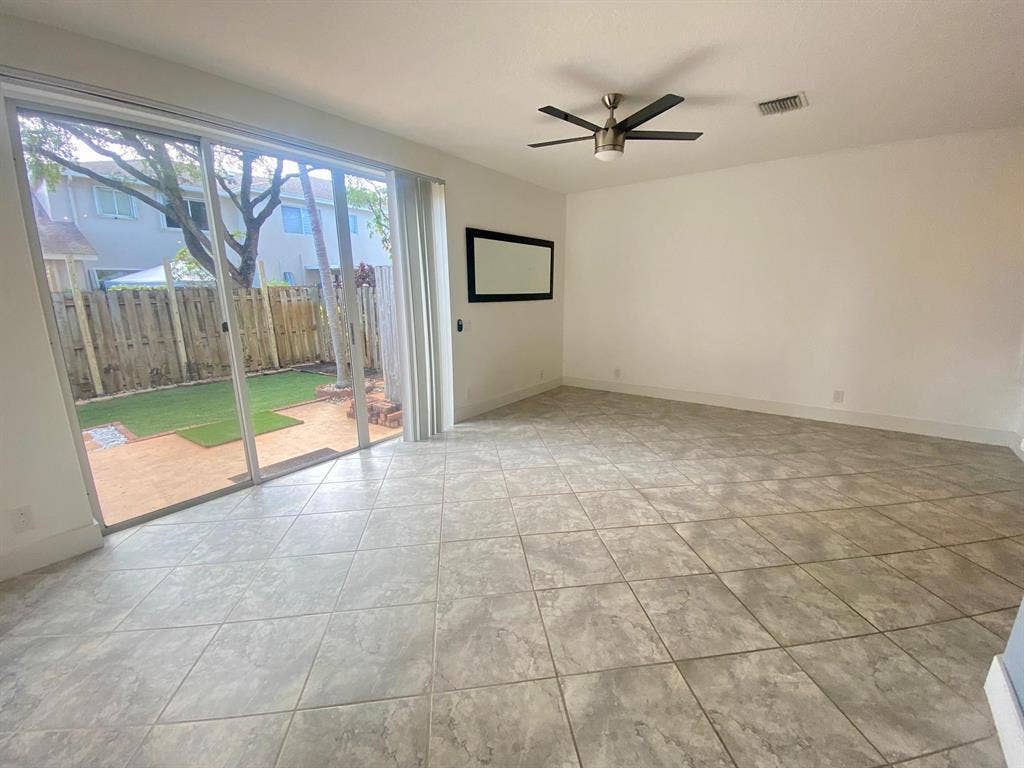 791 NW 42ND Place, Deerfield Beach, Deerfield Beach, FL 33064 Spacious Living room with Slider to the back yard, let the dogs out and watch them play