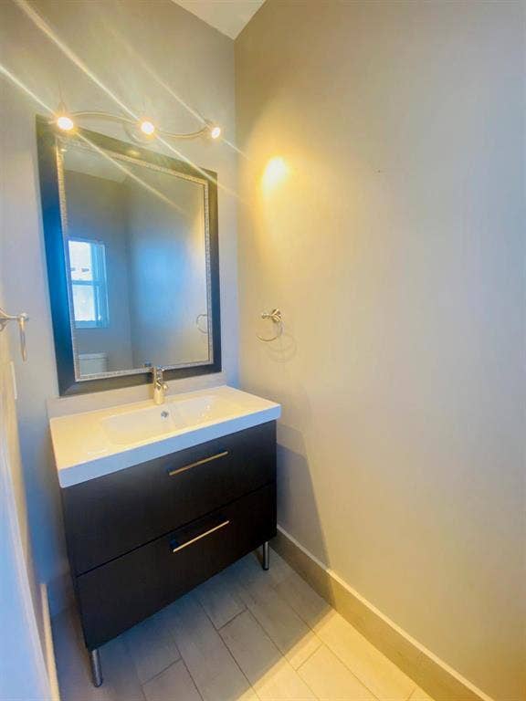 791 NW 42ND Place, Deerfield Beach, Deerfield Beach, FL 33064 Downstairs half bath with modern vanity framed mirror, and track lighting