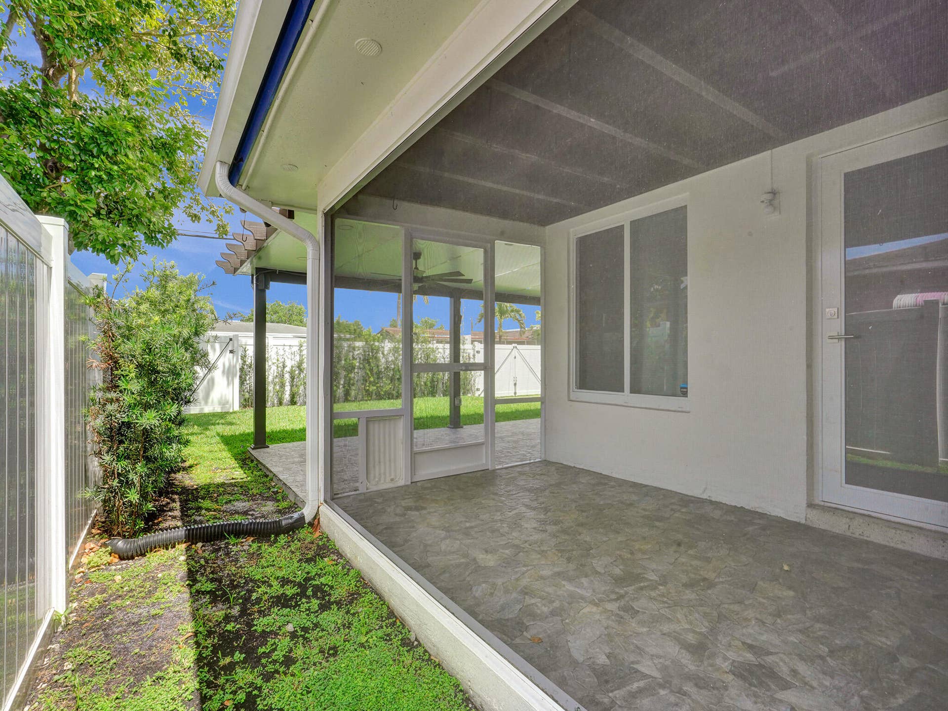 4309 JOHNSON Street, Hollywood, FL 33021 The rear covered and screened patio is large and great for having your morning coffee or entertaining a small group of friends.