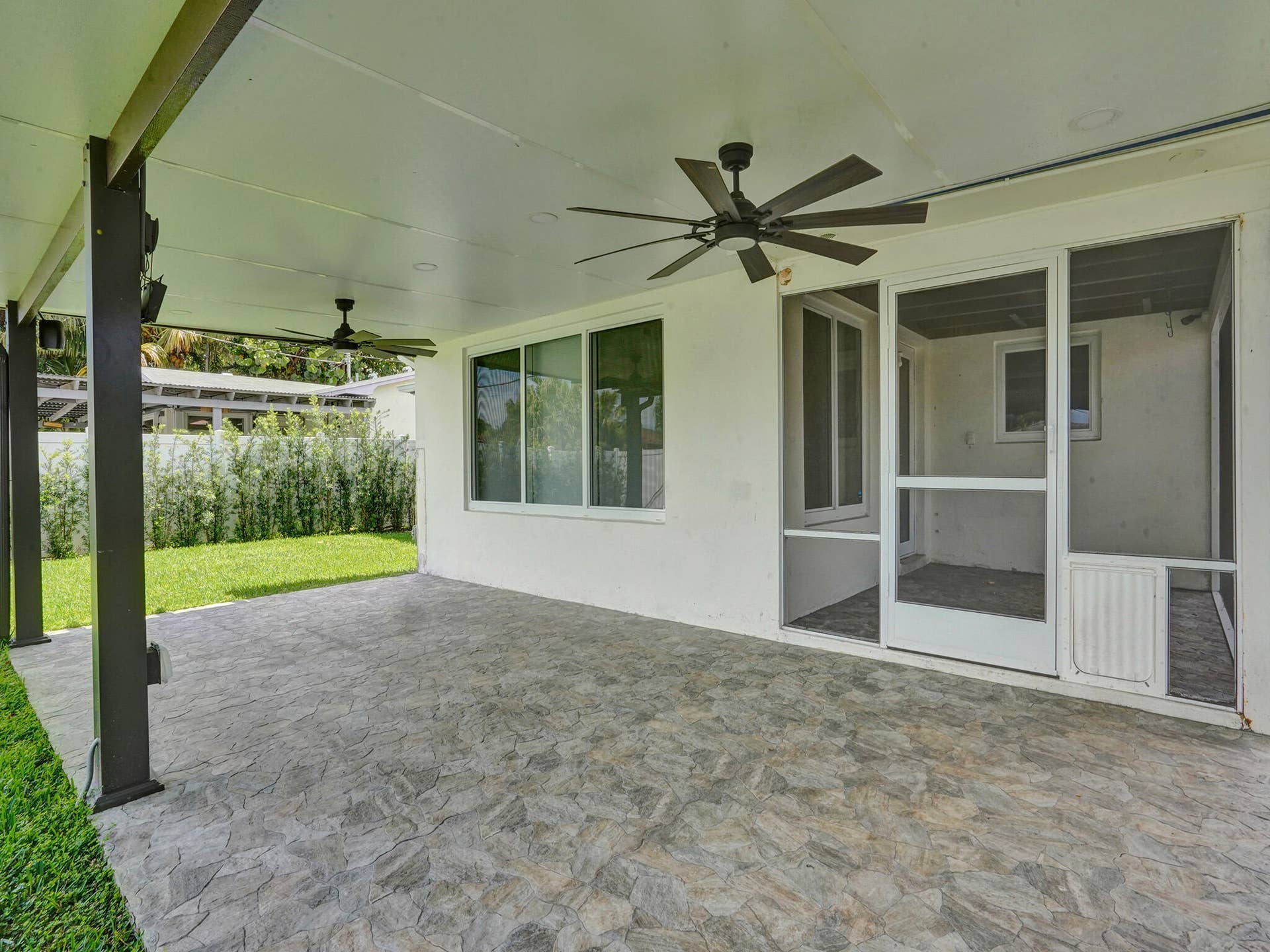 4309 JOHNSON Street, Hollywood, FL 33021 Huge rear patio expands the entire back of the house