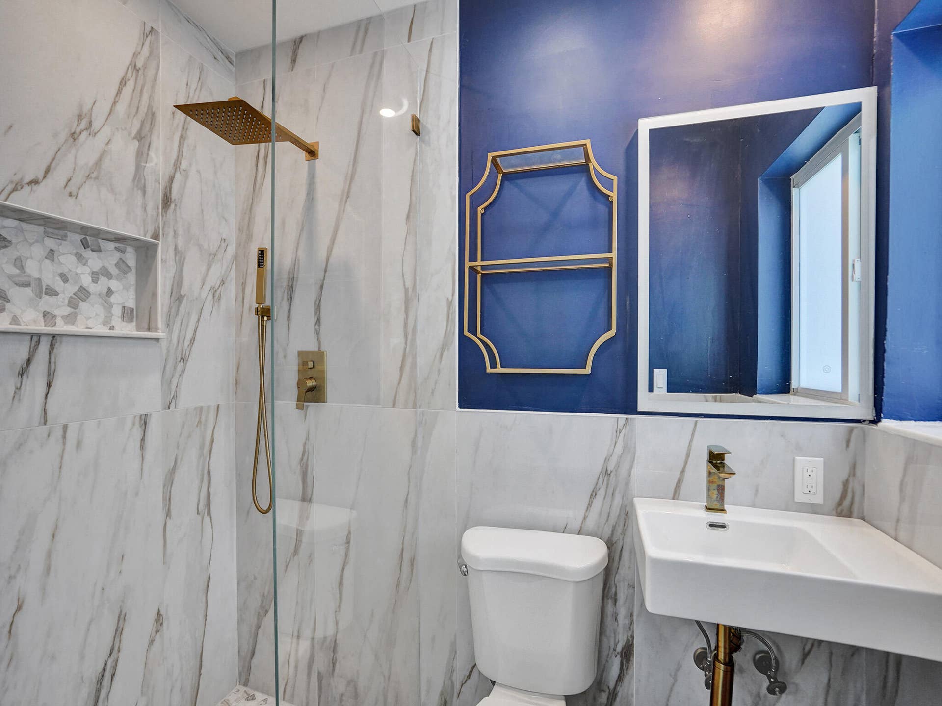 4309 JOHNSON Street, Hollywood, FL 33021 Primary bath with gold trim hardware and standing shower