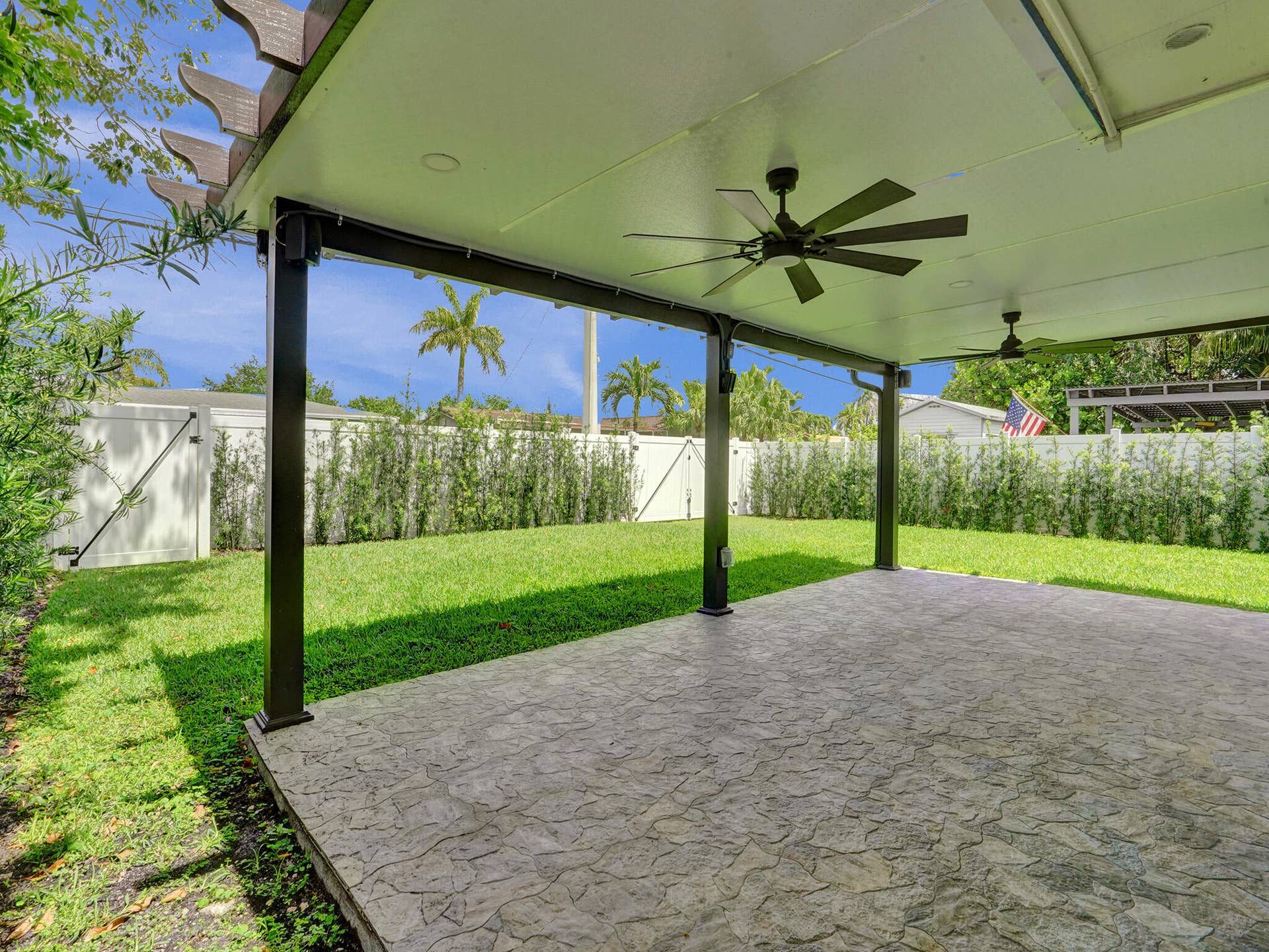4309 JOHNSON Street, Hollywood, FL 33021 Party with friends till the sun comes up on the HUGE covered patio perfect for grilling those game day burgers and hot dogs, watching the dogs run, and enjoying the ceiling fans to keep you cooled off while you have a cocktail and unwind.
