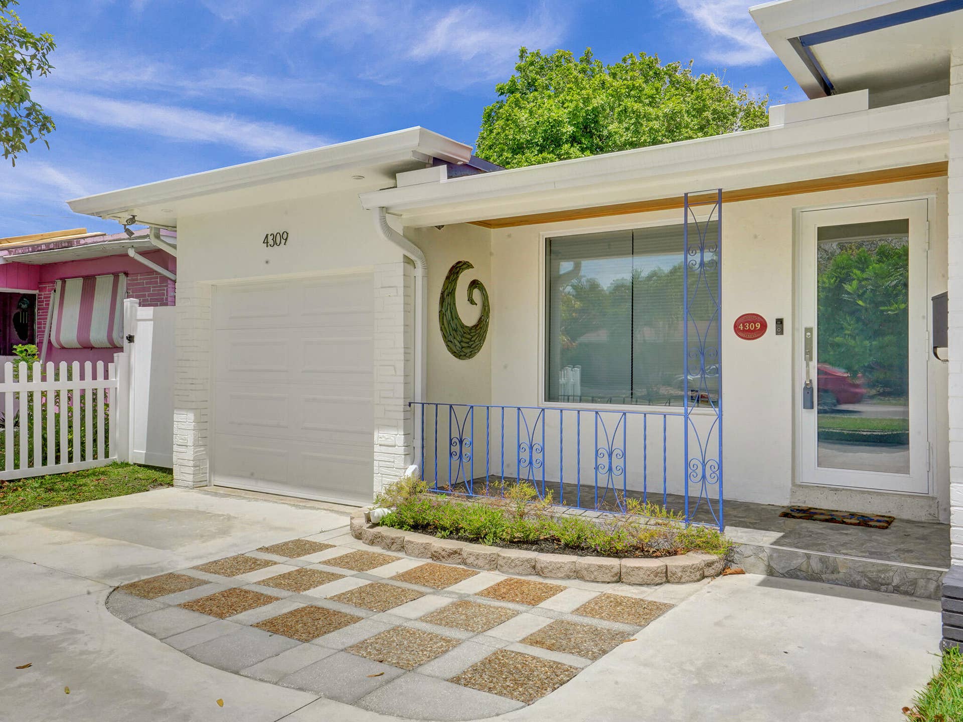 4309 JOHNSON Street, Hollywood, FL 33021 Enjoy your morning coffee on the front porch while overlooking your garden area.