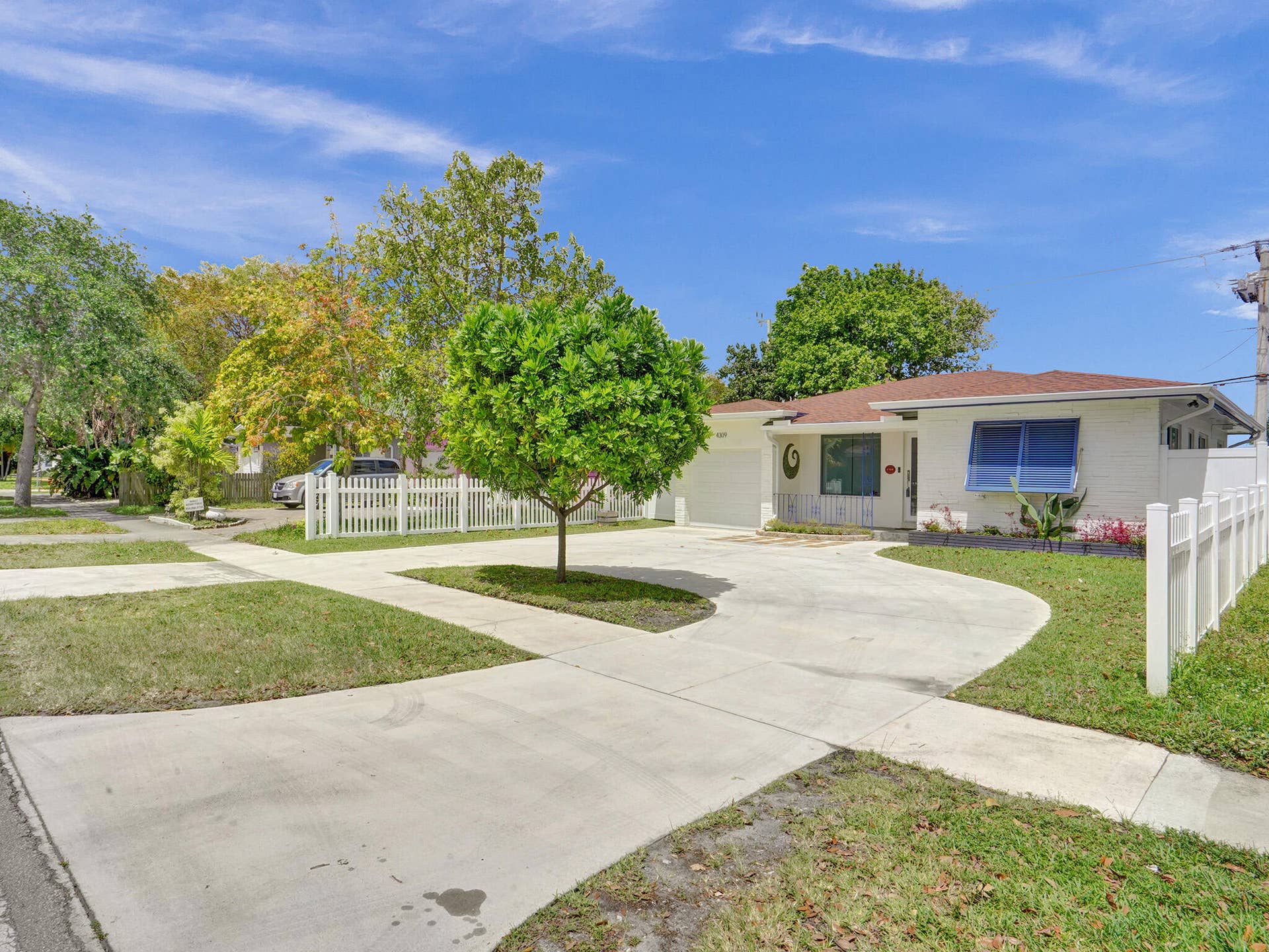 4309 JOHNSON Street, Hollywood, FL 33021 Front entrance with circle driveaway and single car garage with plenty of parking and storage