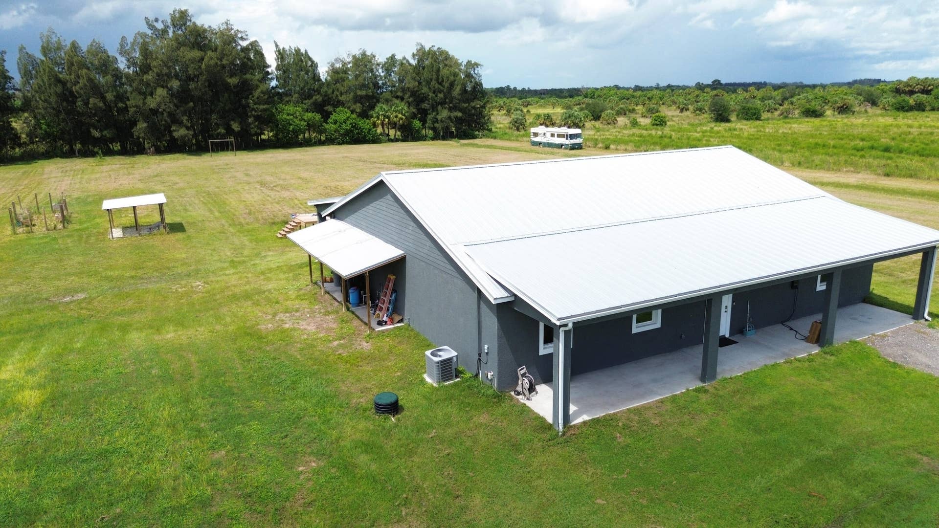 New 2025 CBS home with metal roof and covered porches