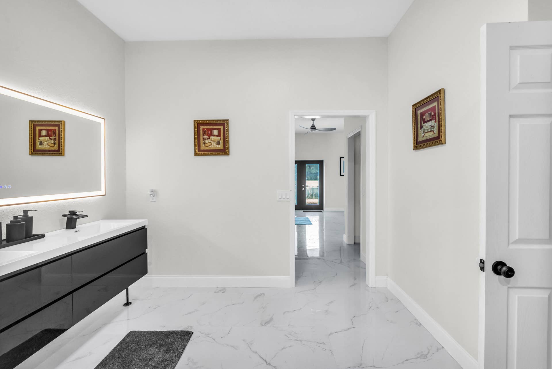 Primary bath with double vanity and lighted mirror