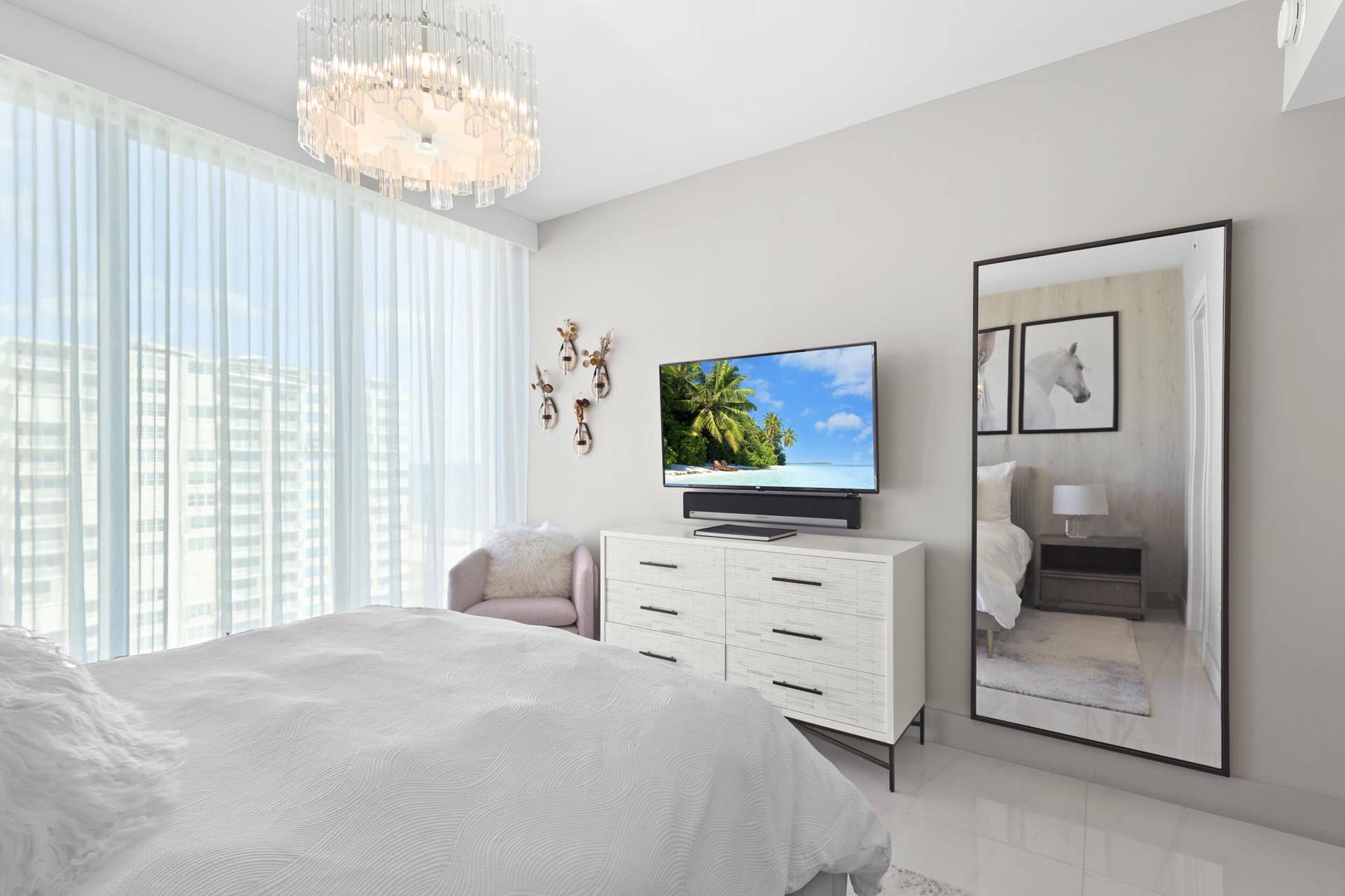 730 N Ocean Boulevard, Pompano Beach, FL 33062 Guest bedroom 1 features more designer touches, automated shades & blinds, customized closet, and ensuite bathroom.