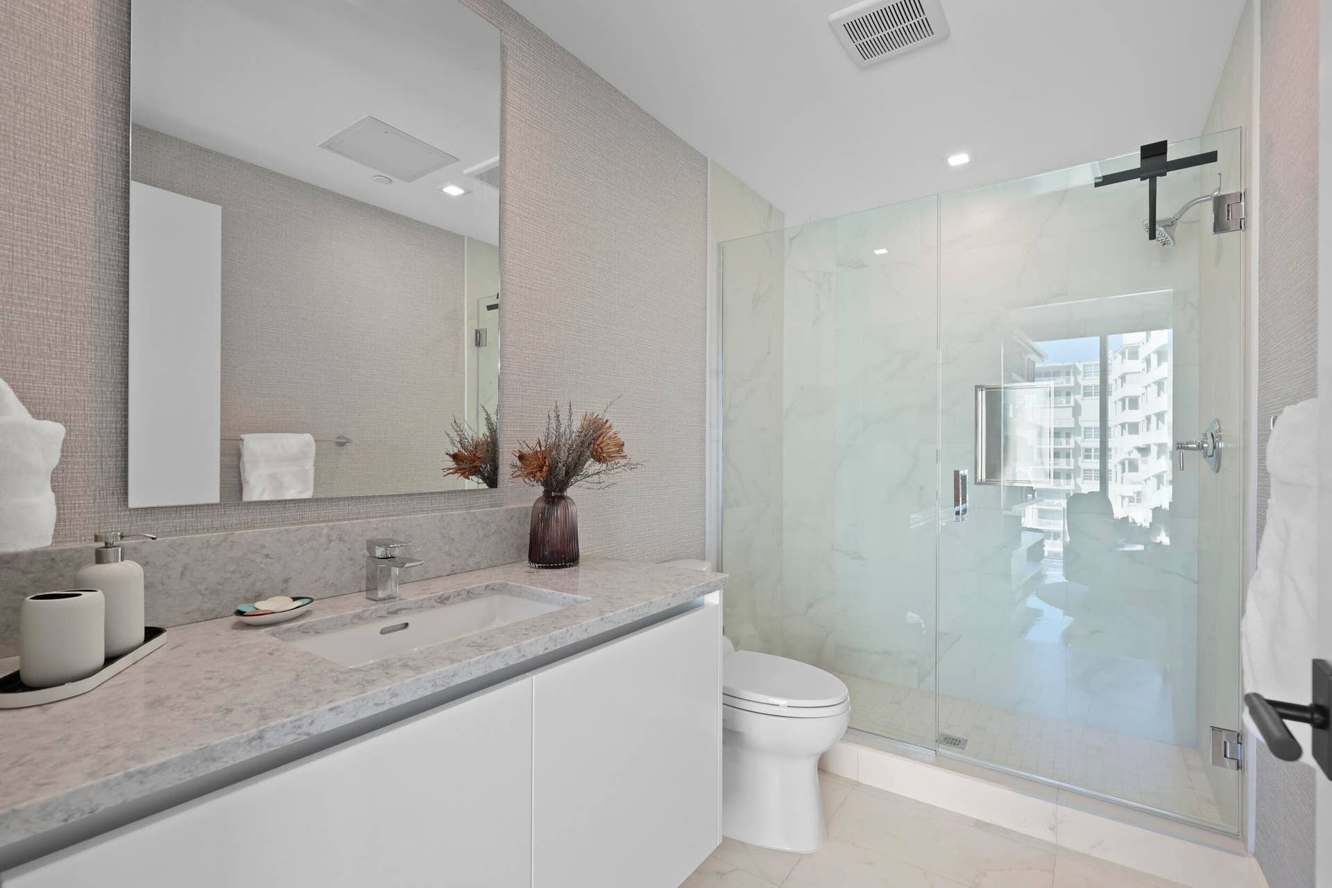 730 N Ocean Boulevard, Pompano Beach, FL 33062 Guest bedroom 2 features more designer touches, automated blinds, customized closet, murphy bed and ensuite bathroom.