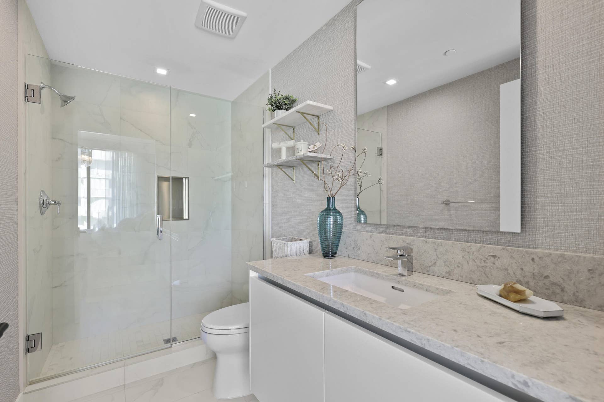 730 N Ocean Boulevard, Pompano Beach, FL 33062 Guest bedroom 1 features more designer touches, automated shades & blinds, customized closet, and ensuite bathroom.