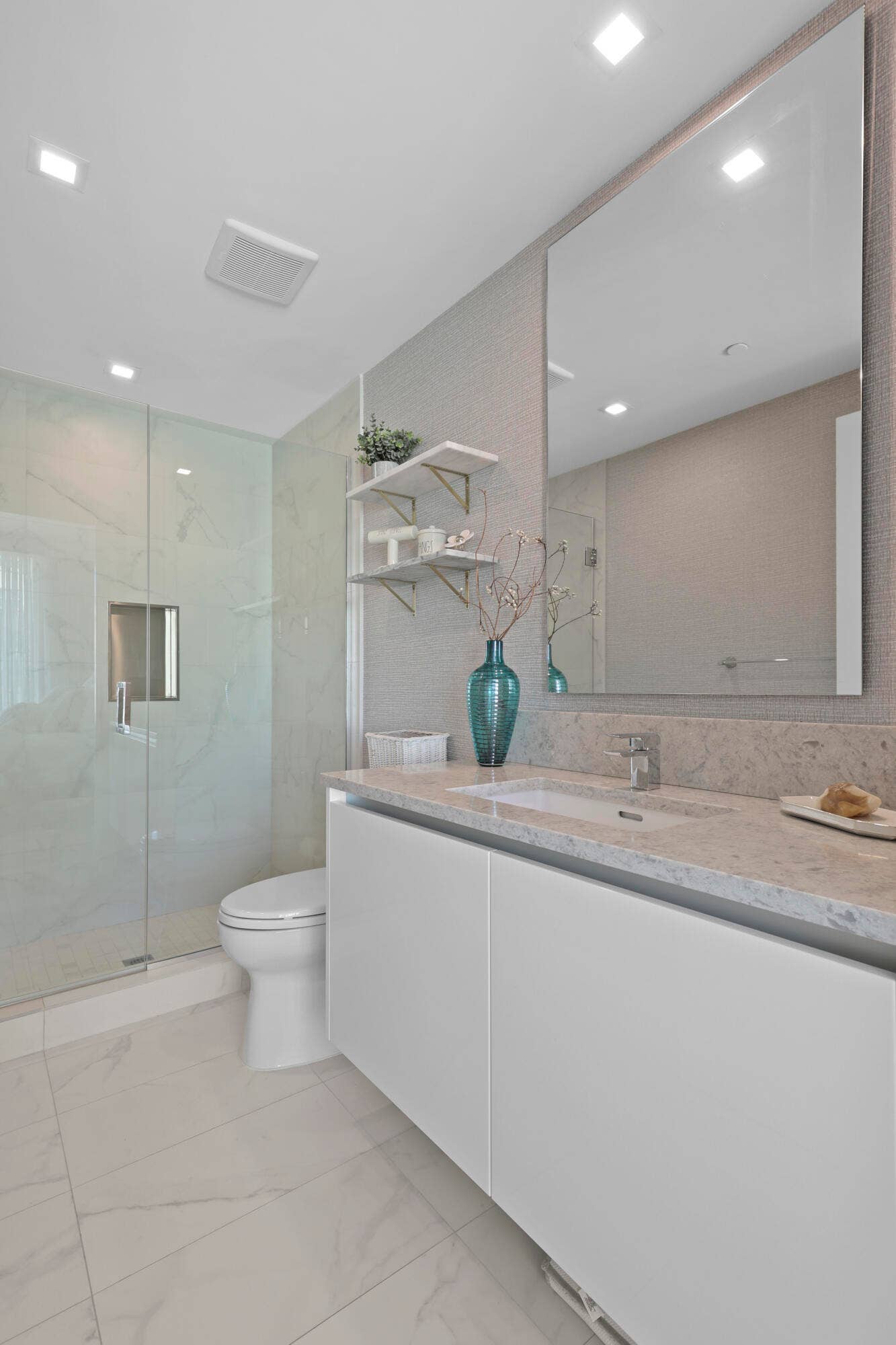 730 N Ocean Boulevard, Pompano Beach, FL 33062 Guest bedroom 1 features more designer touches, automated shades & blinds, customized closet, and ensuite bathroom.