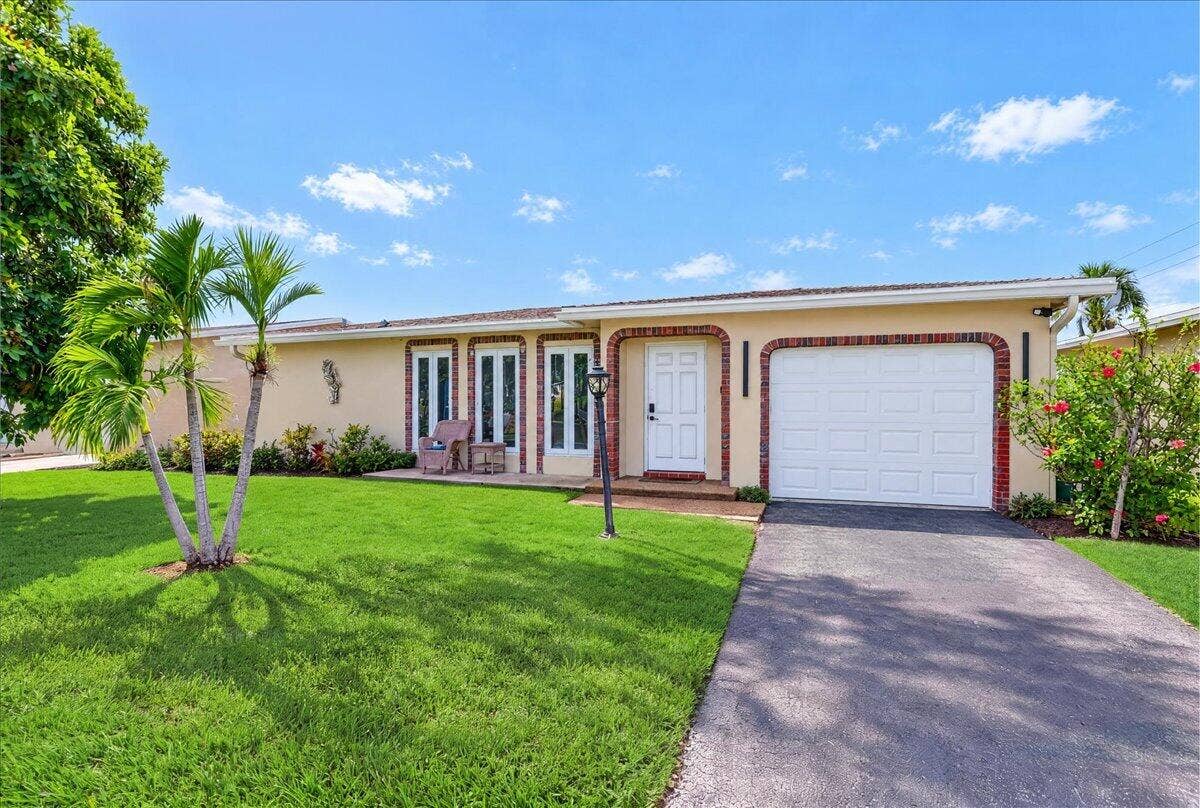 4911 NW 14TH, Deerfield Beach, FL 33064 Front