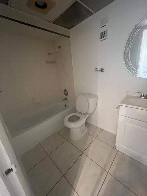 480 EXECUTIVE CENTER Drive, #2F, West Palm Beach, West Palm Beach, FL 33401 White tile flooring throughout with a white vanity and integrated sink