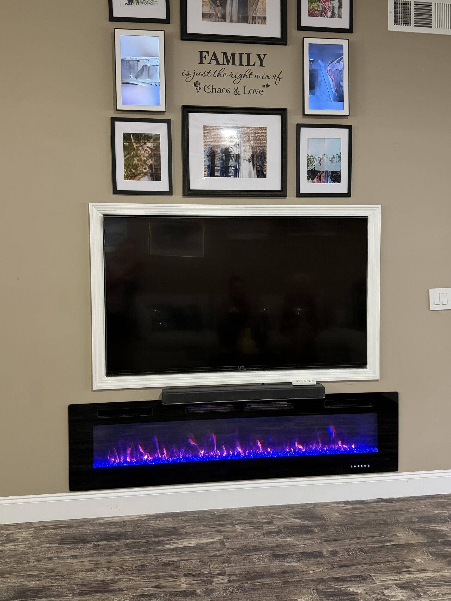 Jupiter, FL 33458 TV built into wall. Color changing fireplace