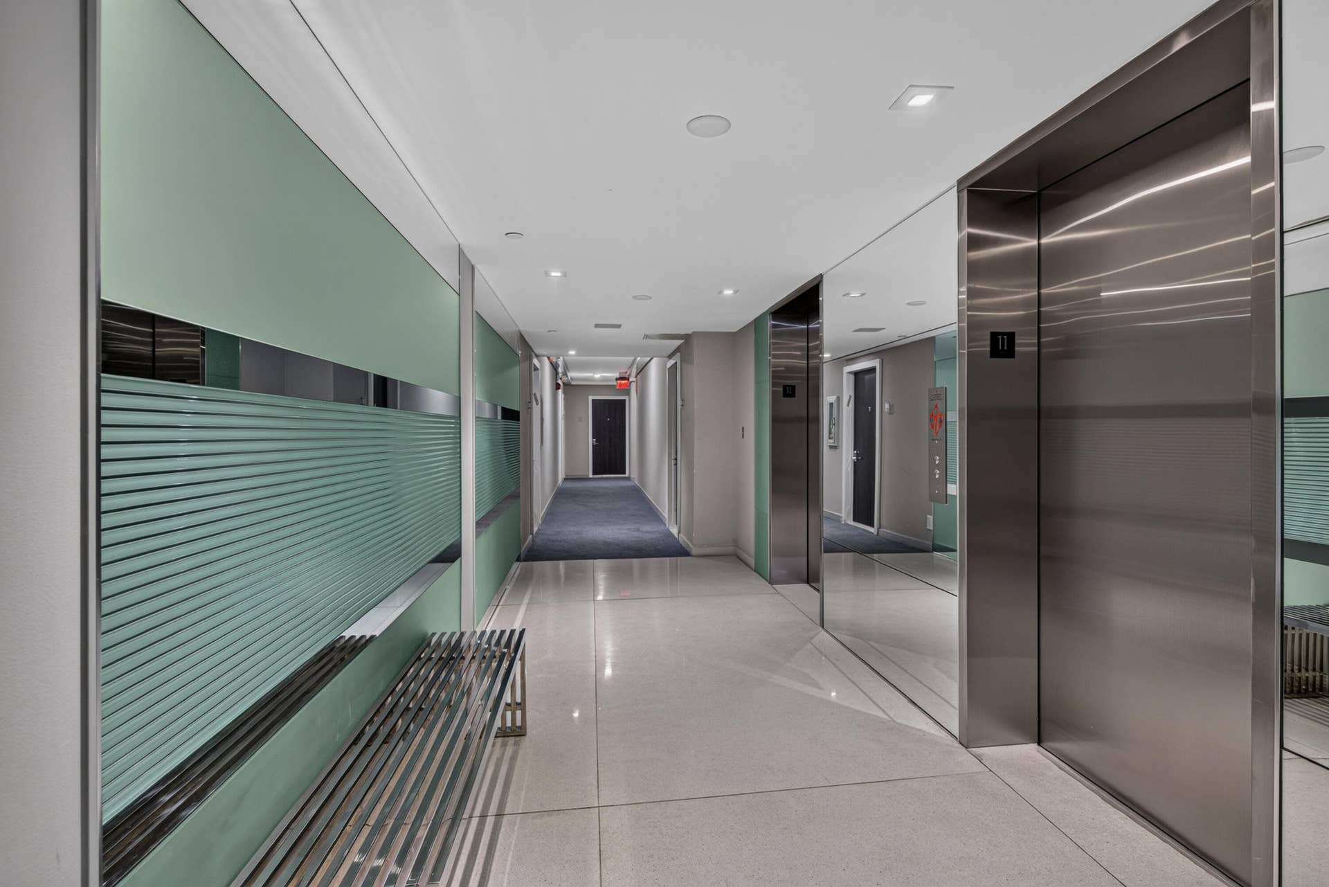 20379 W COUNTRY CLUB Drive, #1139, Aventura, FL 33180 Modern hallway featuring recessed lighting, light-colored flooring, and brushed stainless steel elevator doors