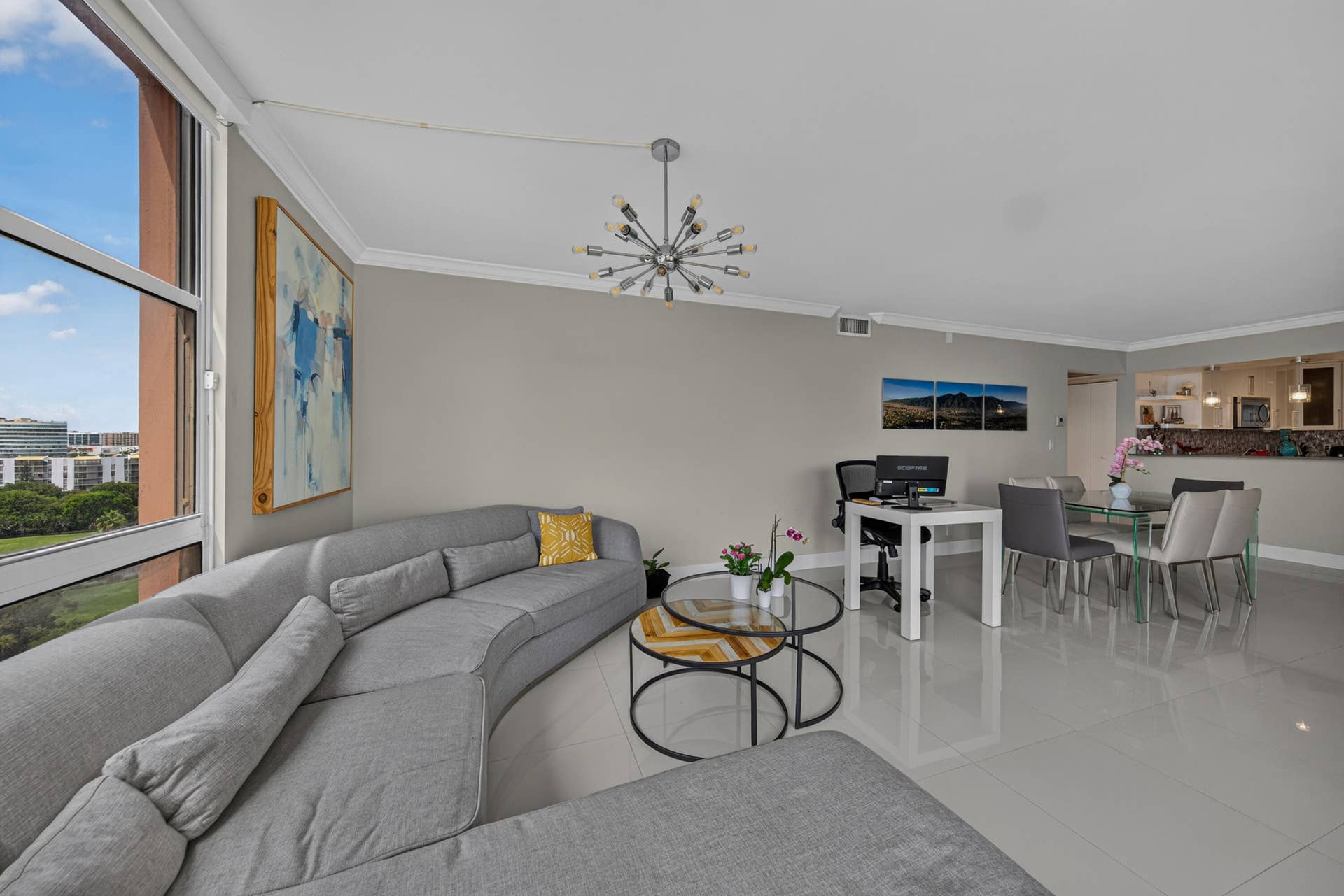 20379 W COUNTRY CLUB Drive, #1139, Aventura, FL 33180 Spacious open-concept living area featuring light-toned flooring, crown molding, and a modern ceiling fixture