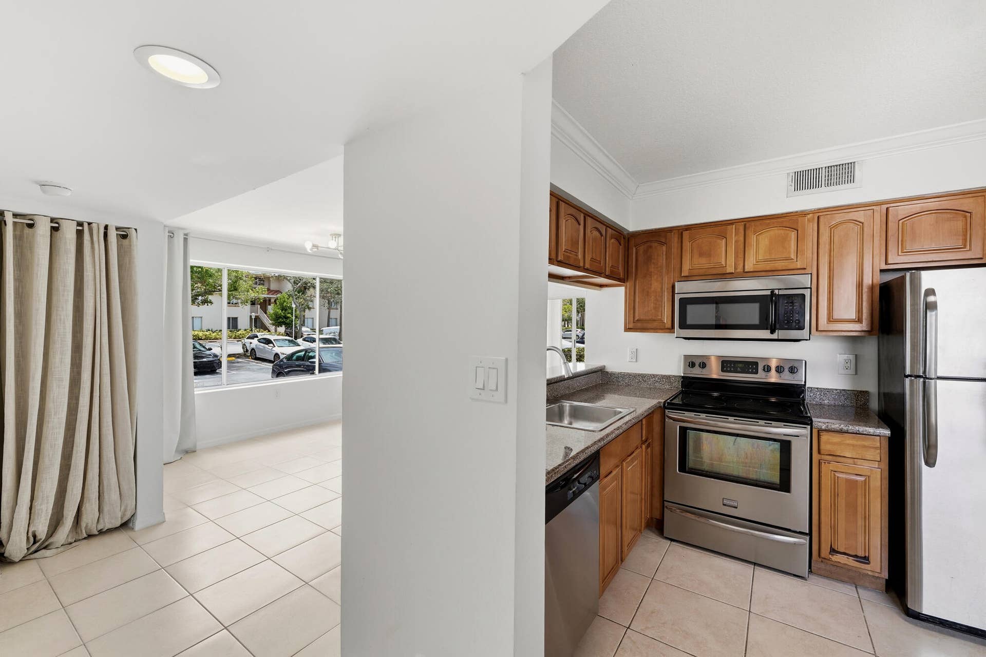 20101 Glenmoor Drive, West Palm Beach, West Palm Beach, FL 33409 Kitchen featuring wood cabinetry, stainless steel appliances, and granite countertops